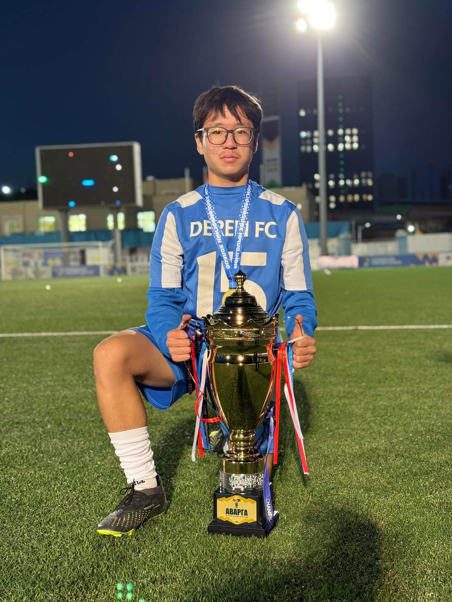 Erkhembold with MFF U14 League trophy
