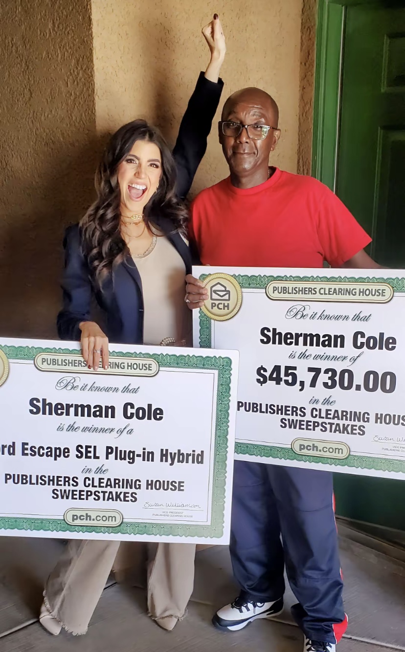 Sherman Cole celebrating PCH sweepstakes win with dual prize packages