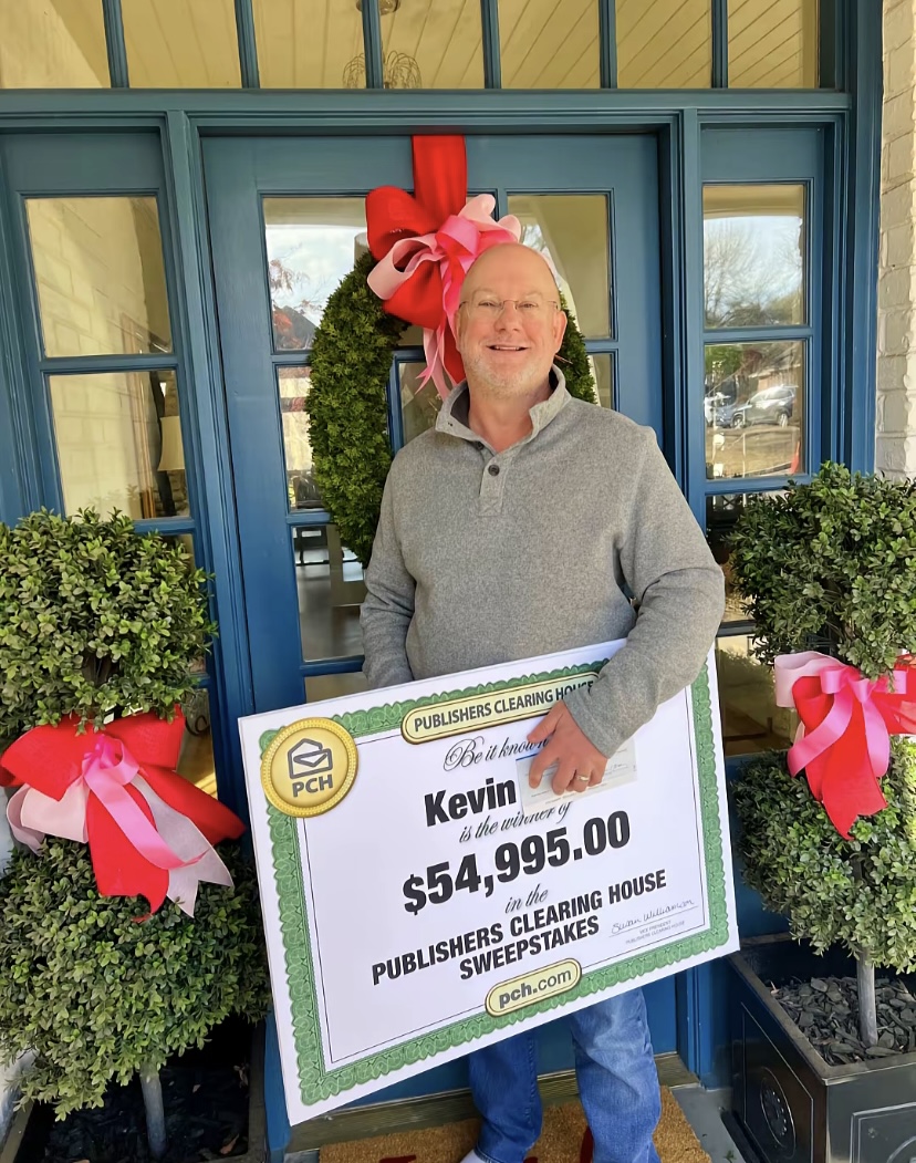 Kevin celebrating PCH award of $54,995.00 with festive holiday decorations