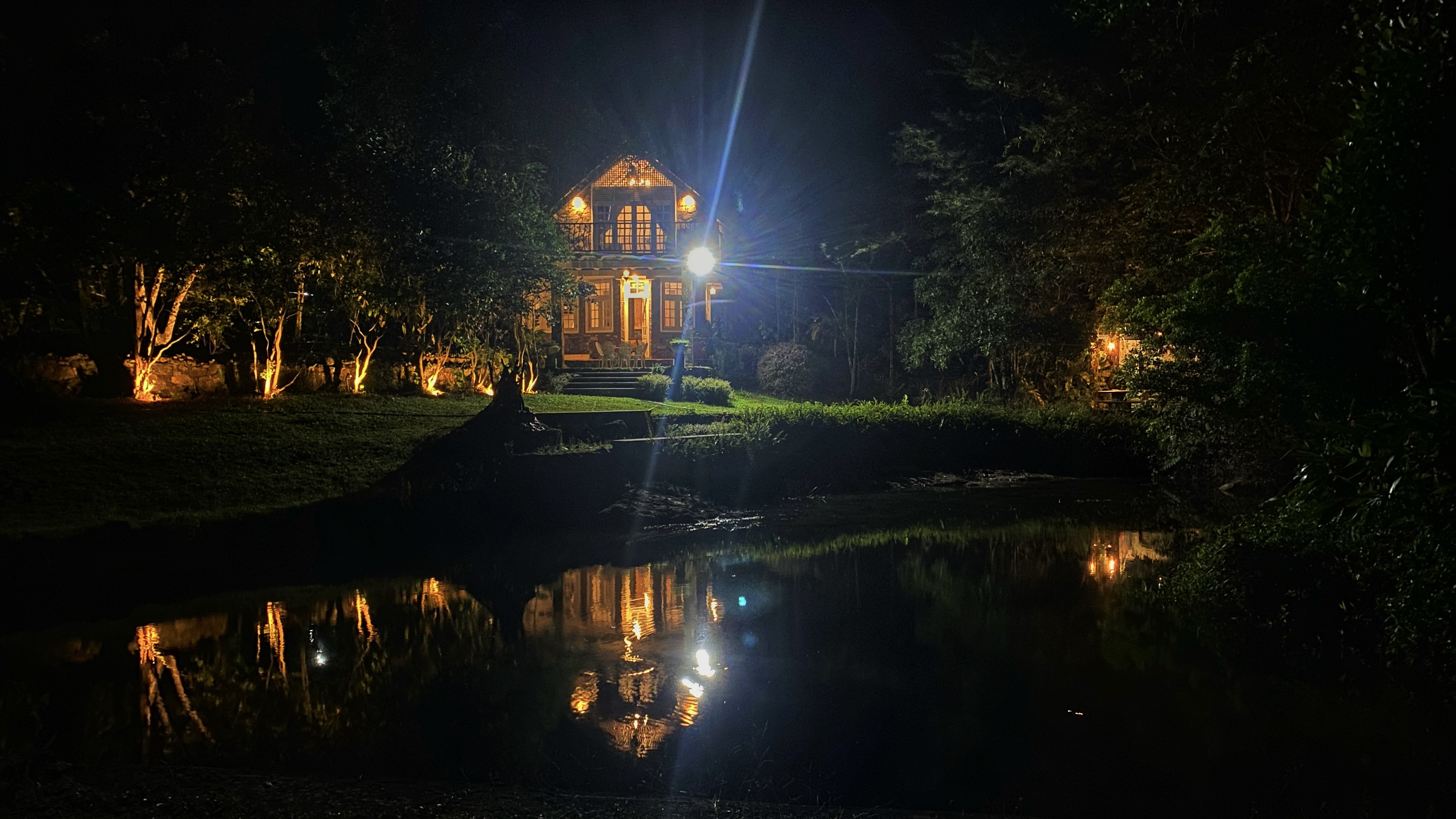 Murk Estate villa at night with reflection