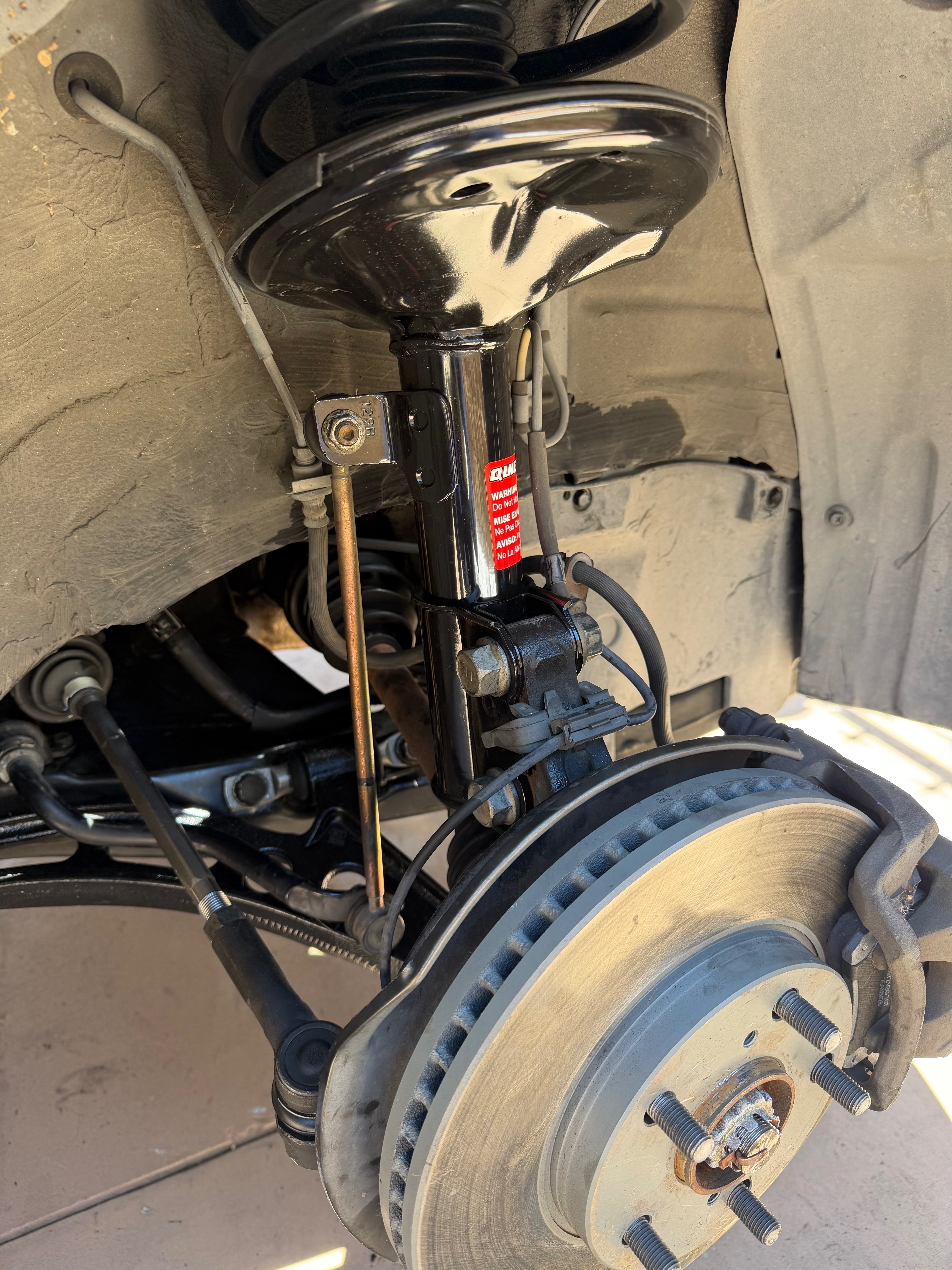 New strut and suspension assembly