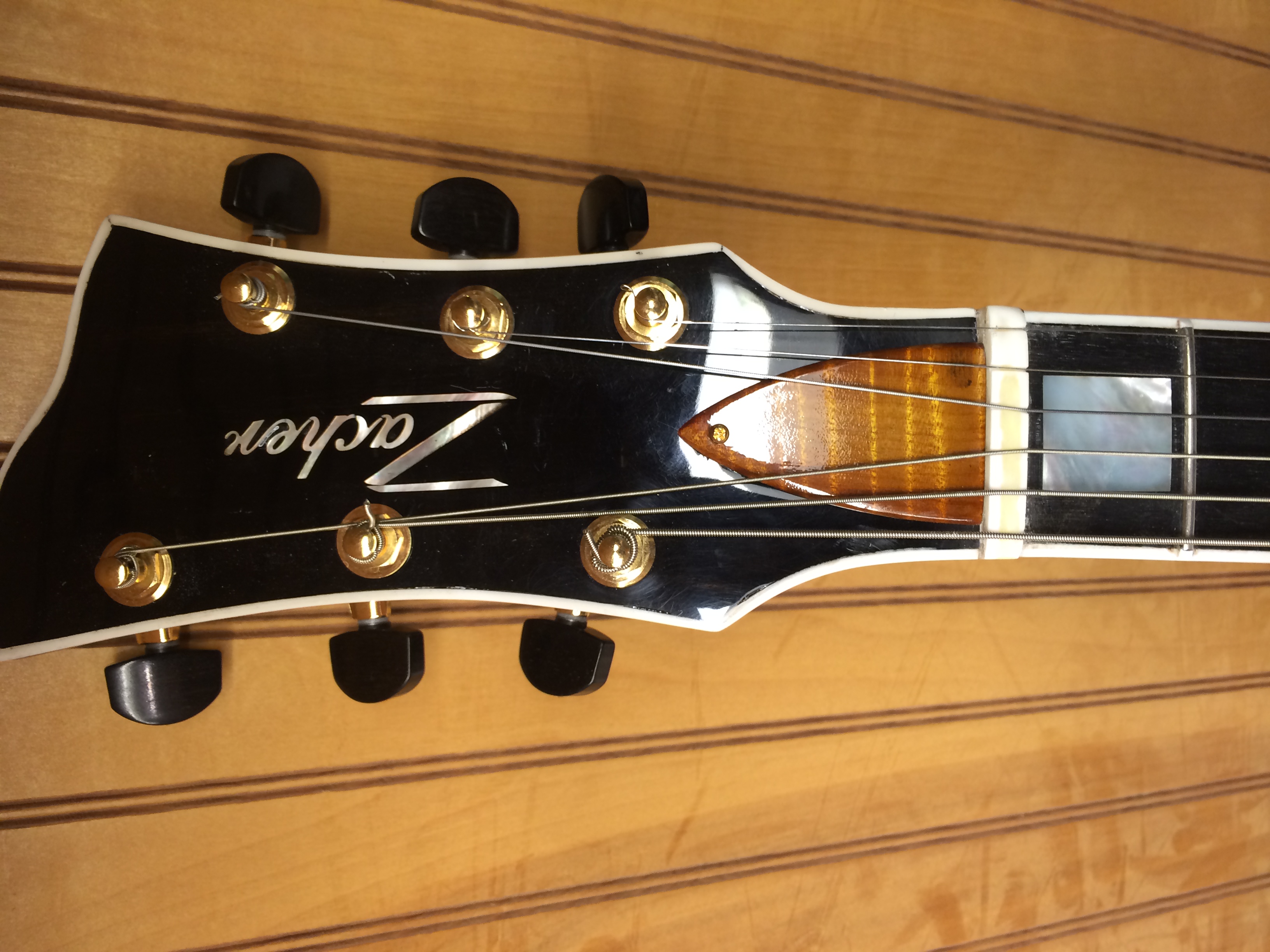Black Headstock with Gold Tuners