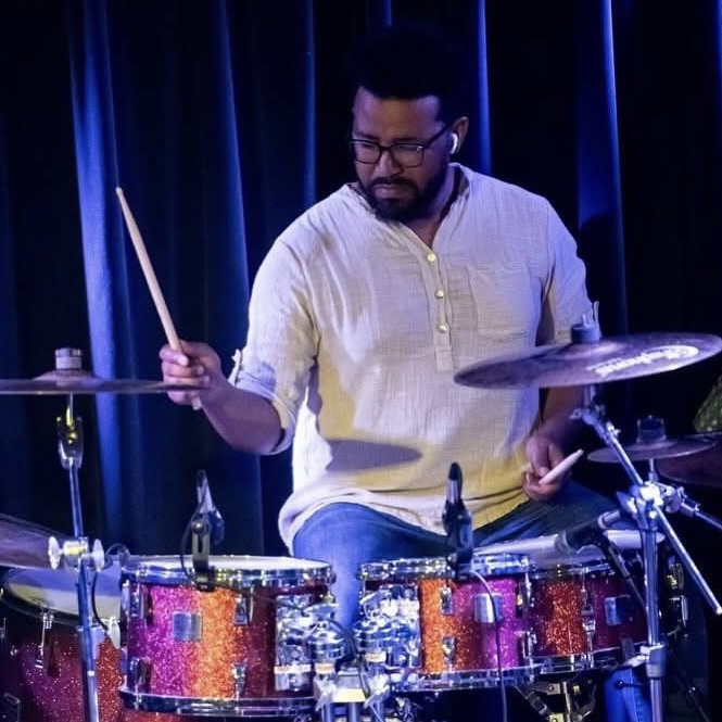 Mulugeta Biratu performing on drums