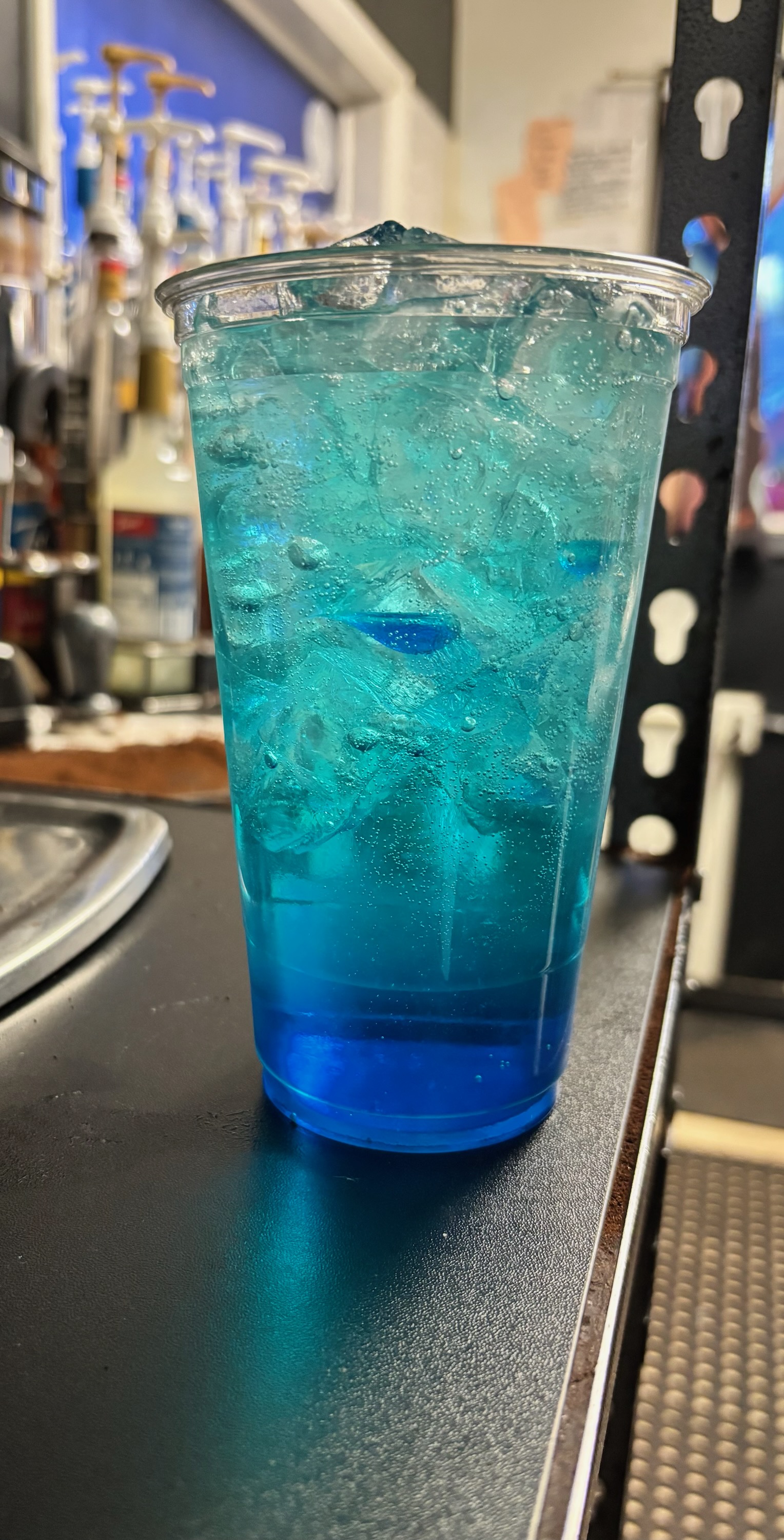 Refreshing blue Italian soda with ice