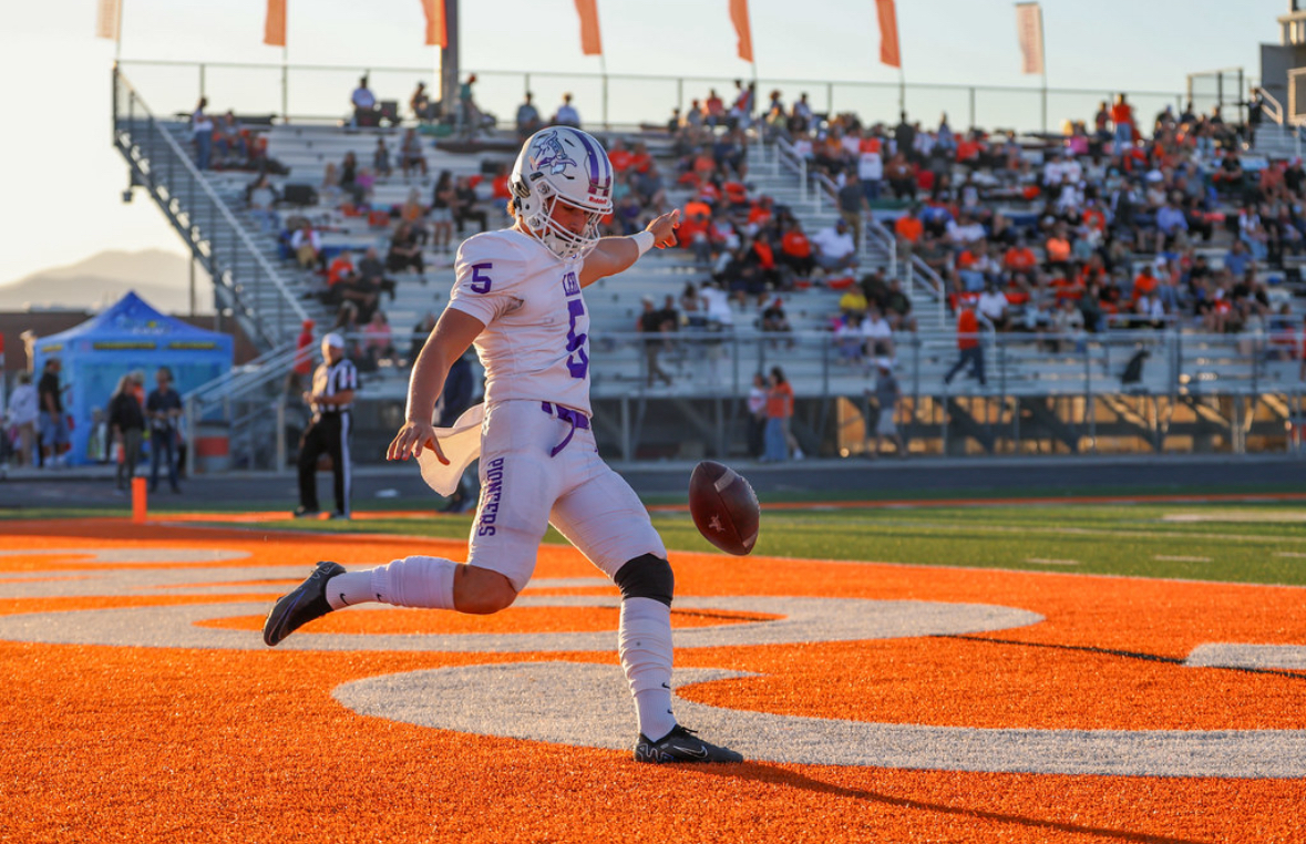 Punt in orange end zone during golden hour