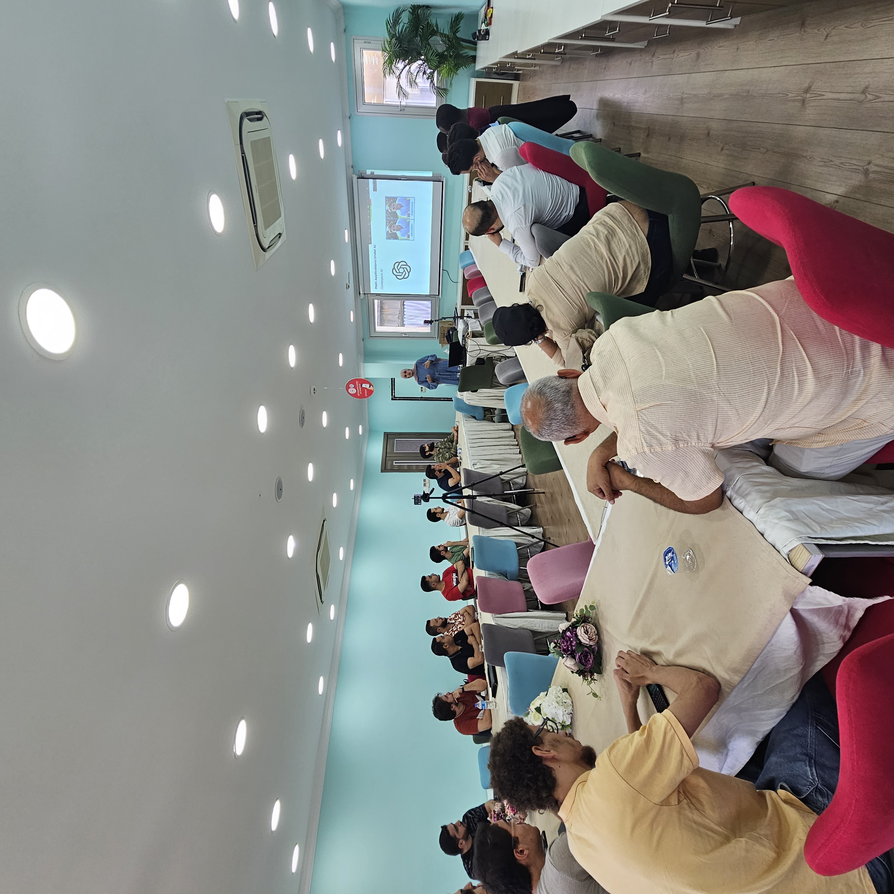 Large-scale AI training session with audience in a conference room