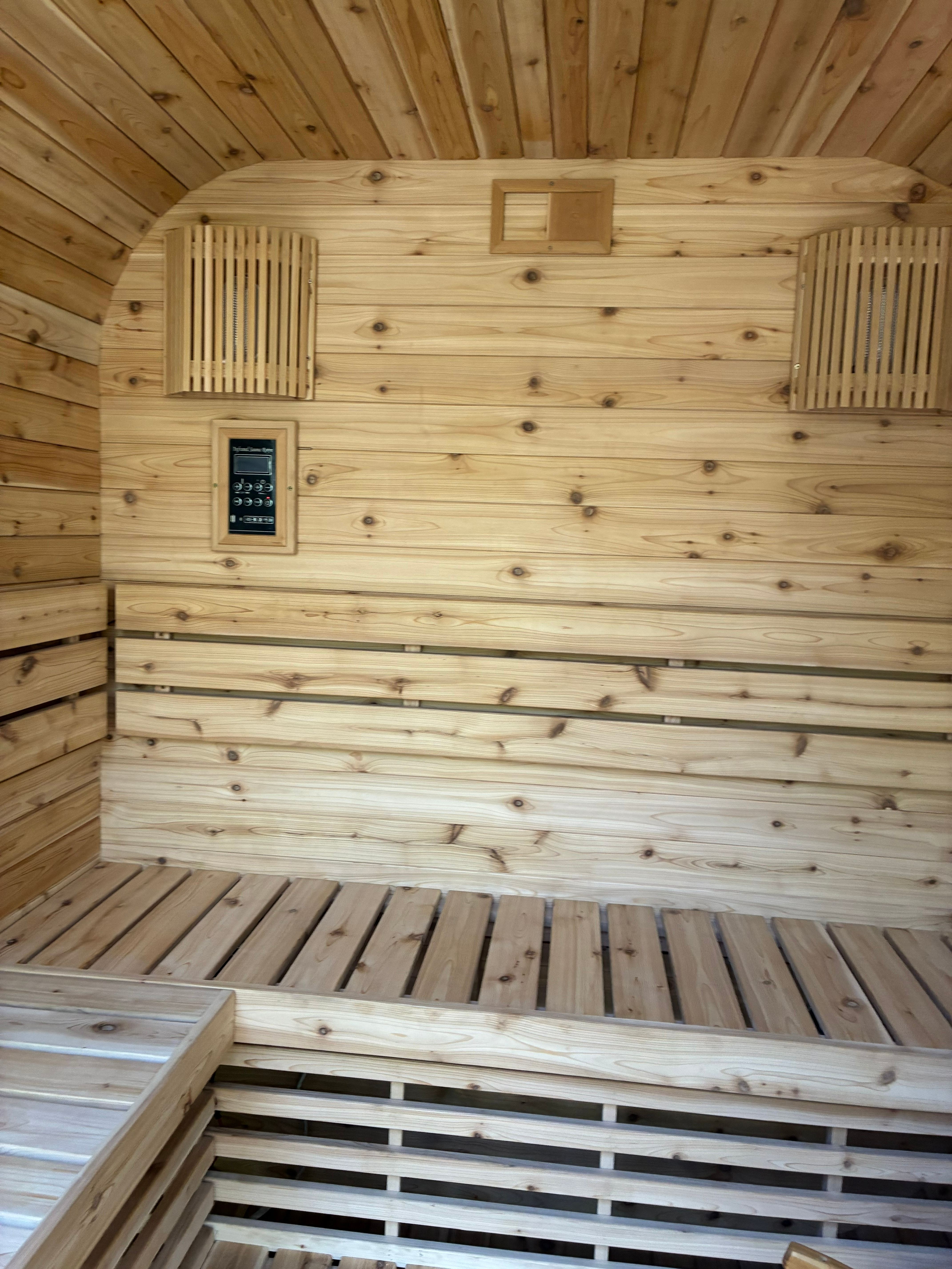 Finished cedar interior with tiered bench seating, digital control panel and ceiling ventilation