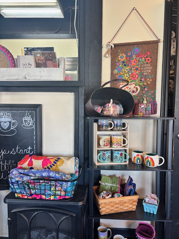 Gift shop display with mugs and local crafts