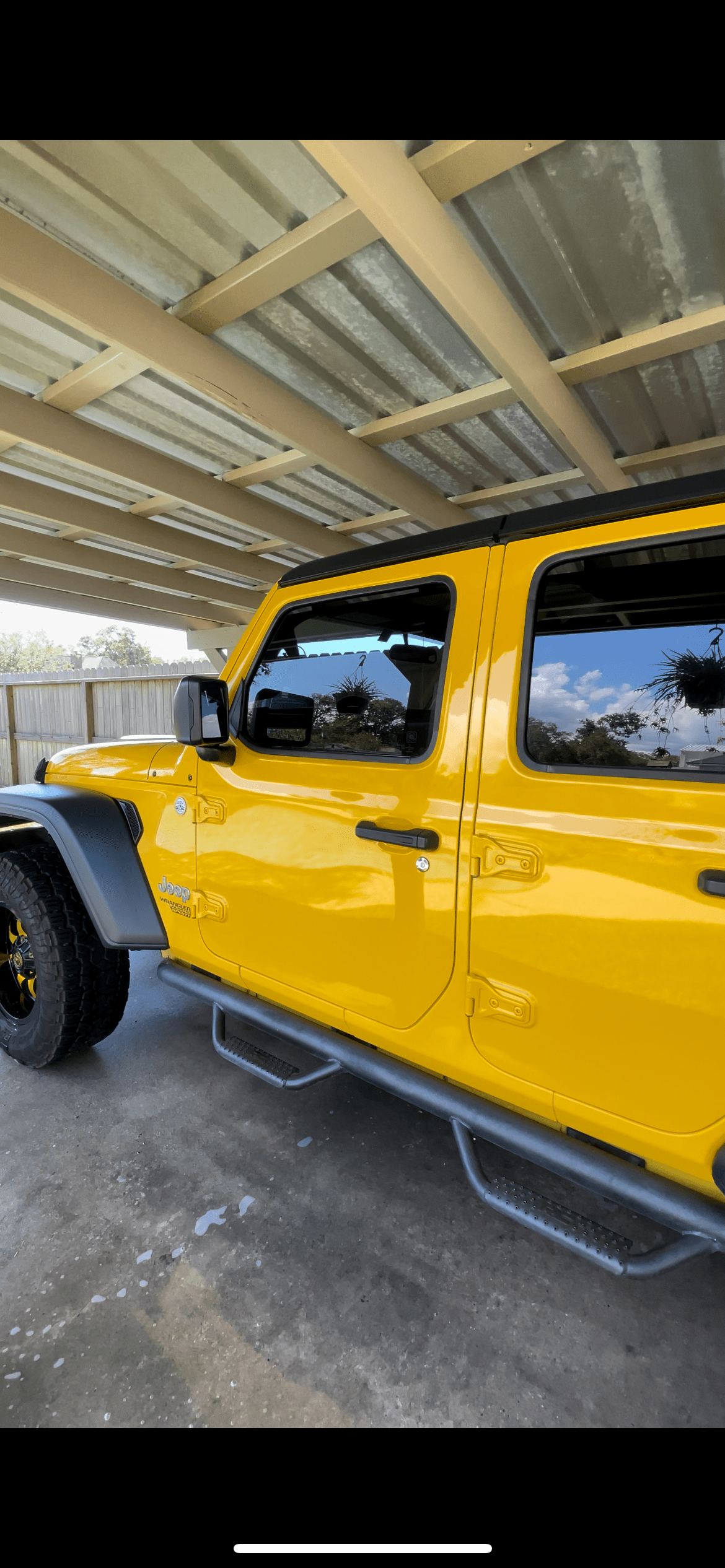 Yellow Jeep Wrangler with a deep gloss finish after an exterior detail