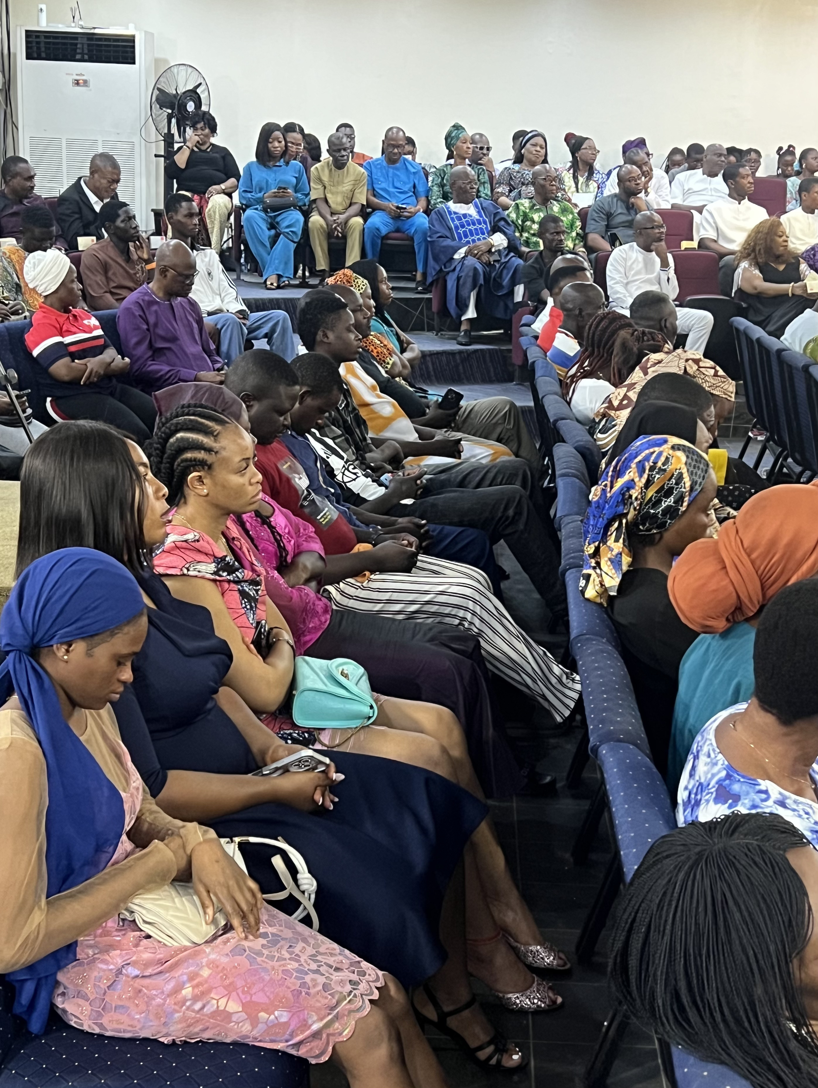 Diverse congregation in colorful attire