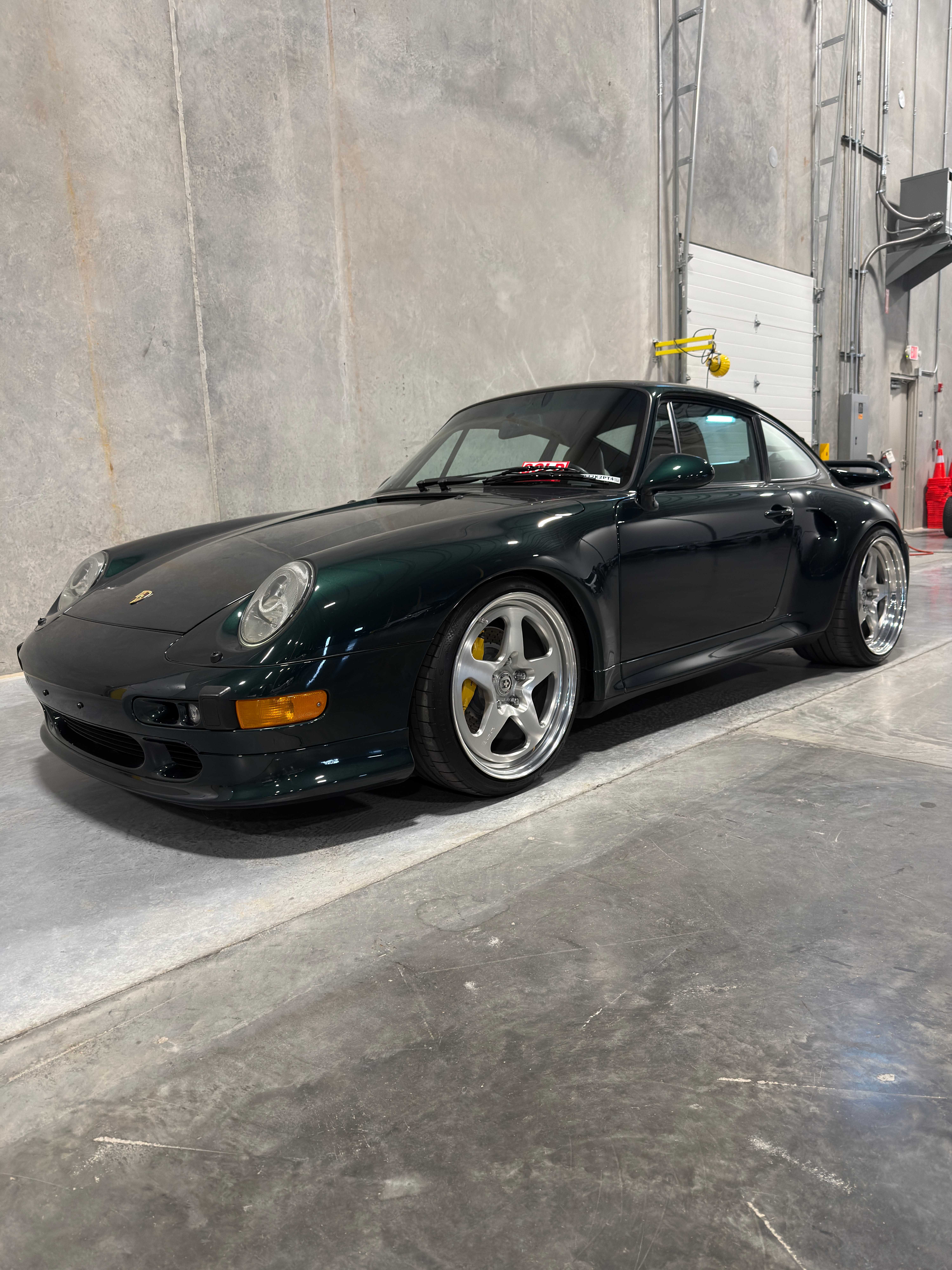 Porsche 993 Turbo in Oak Green with polished 3-piece wheels