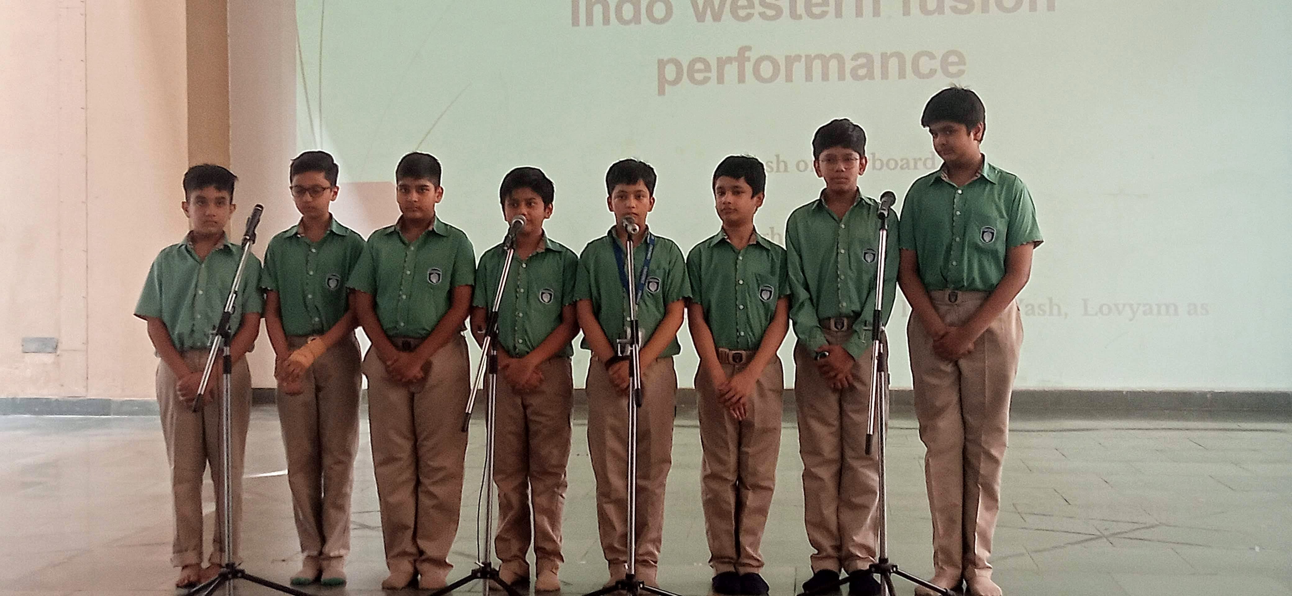 Akshat with his school group during a presentation