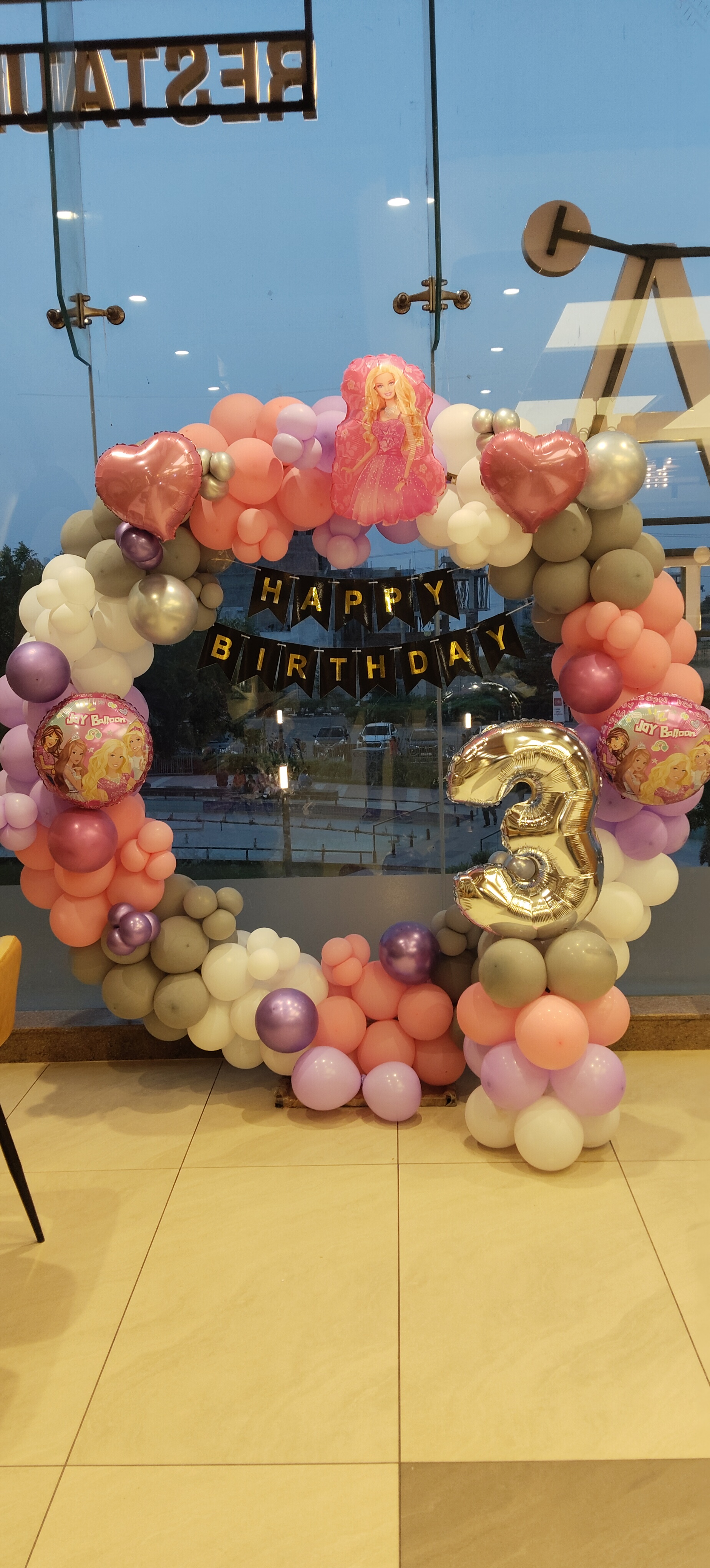 Barbie theme birthday balloon circle with Happy Birthday banner