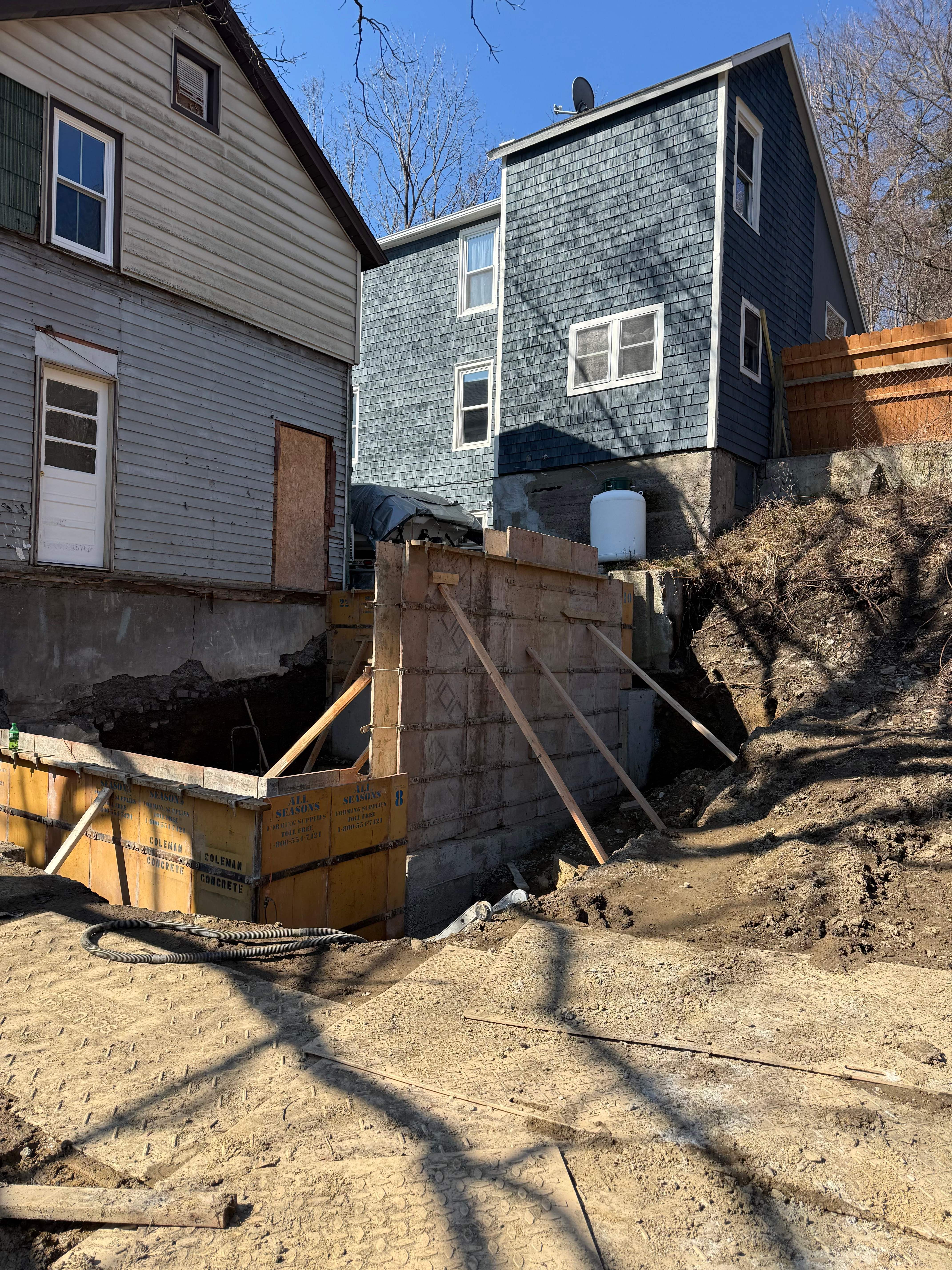 Residential foundation wall forms with houses