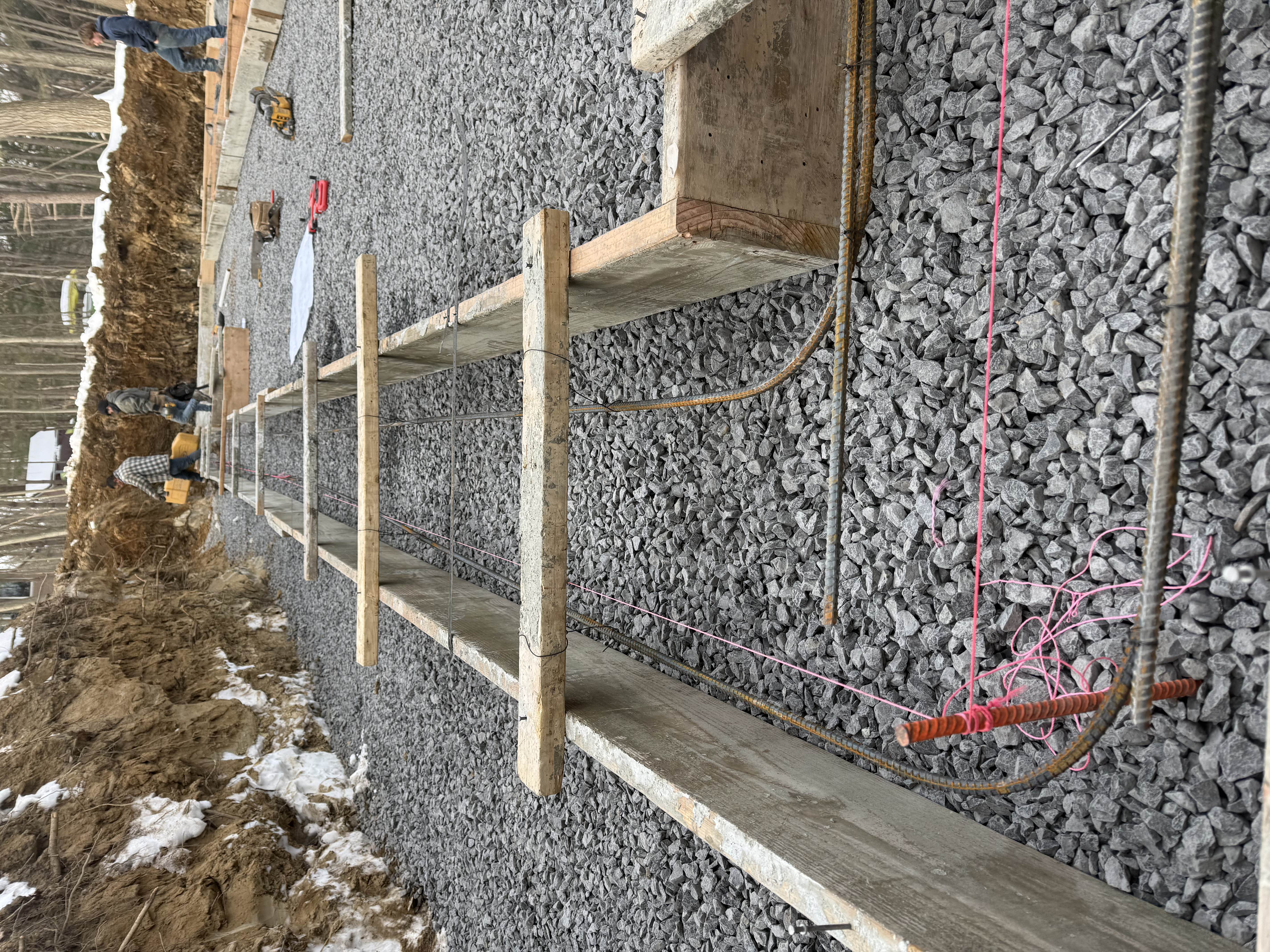 Long footing forms with rebar and crew