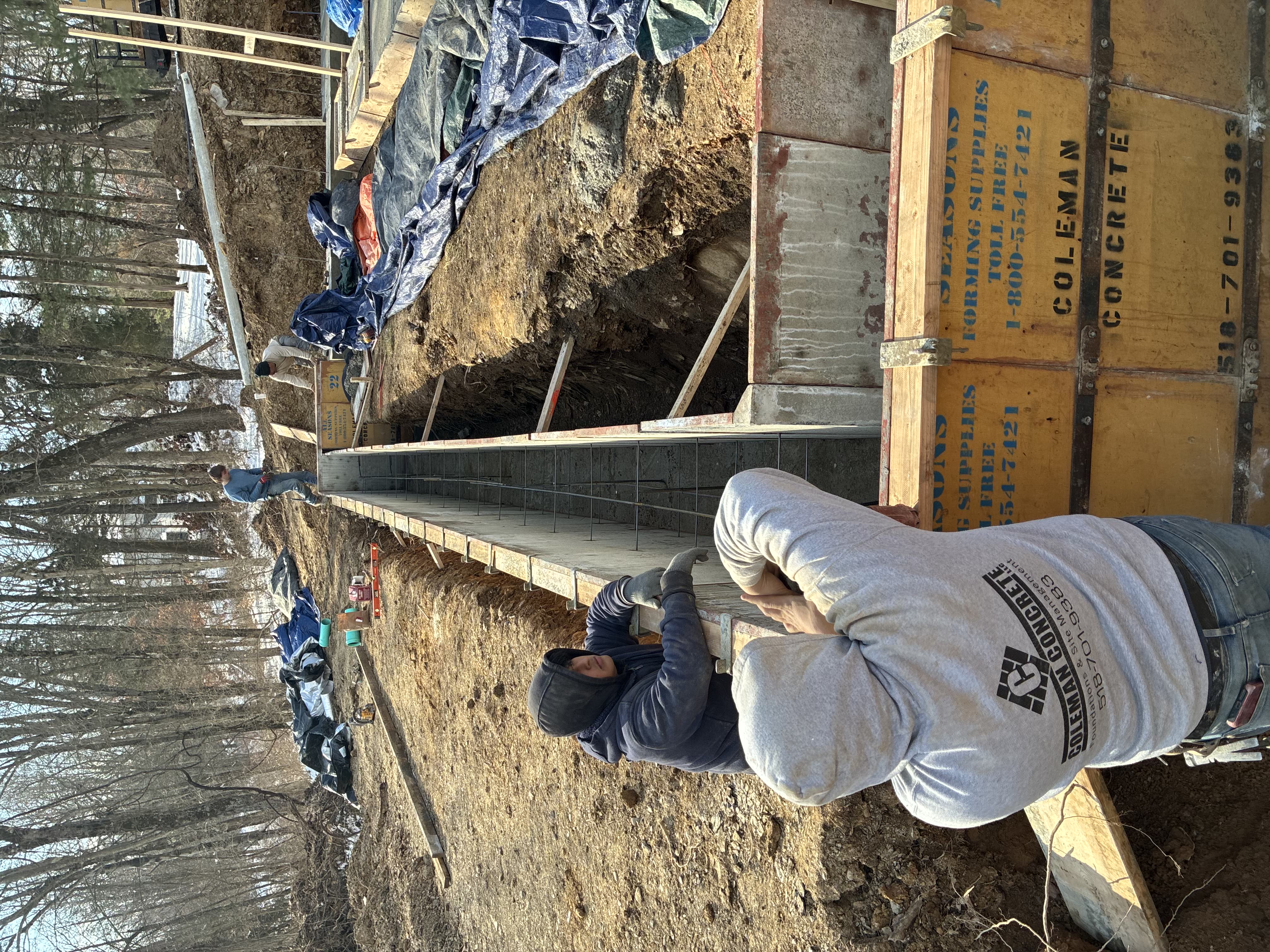 Coleman Concrete crew working on foundation wall forms