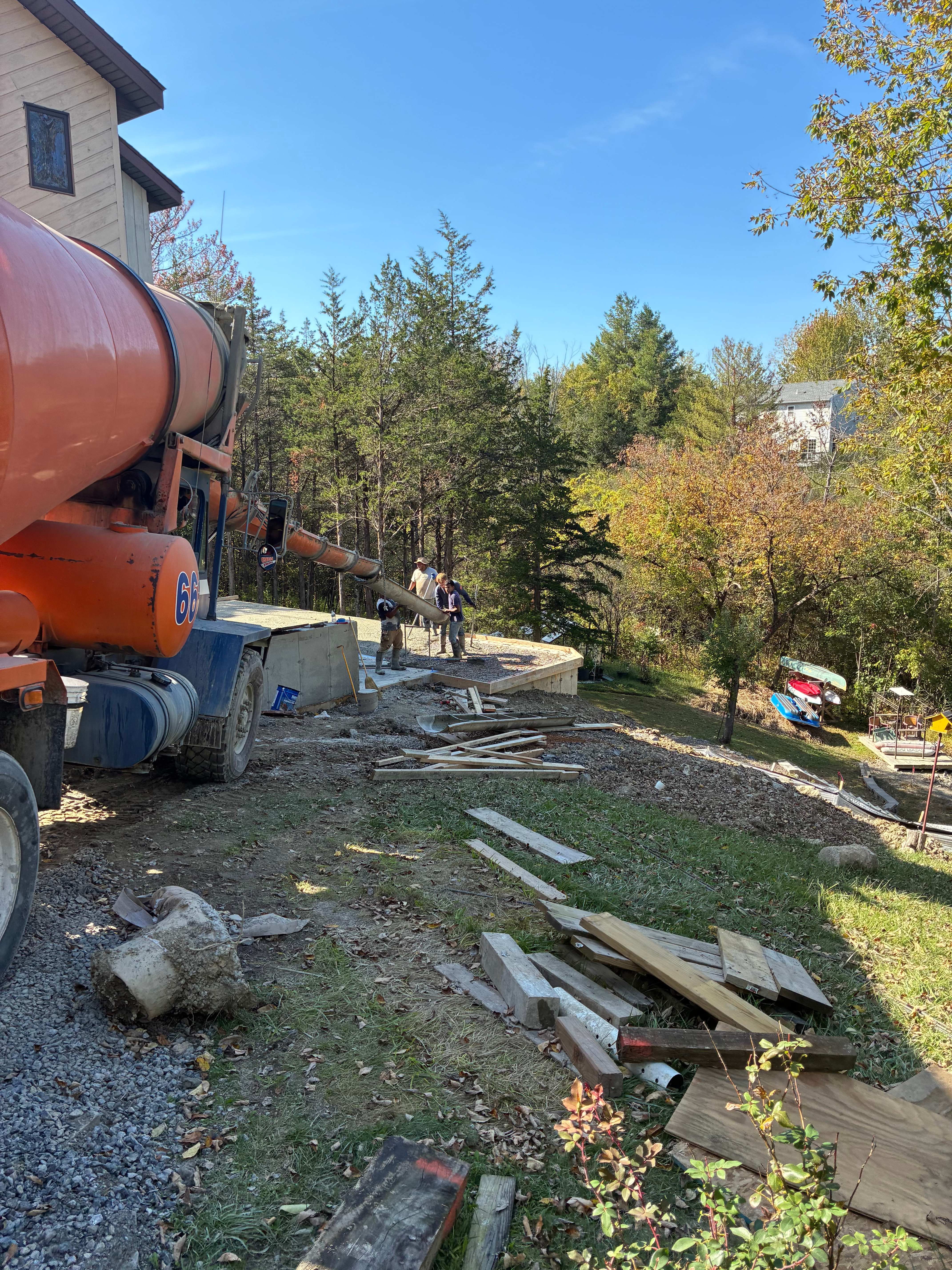 Concrete mixer pouring into residential slab form