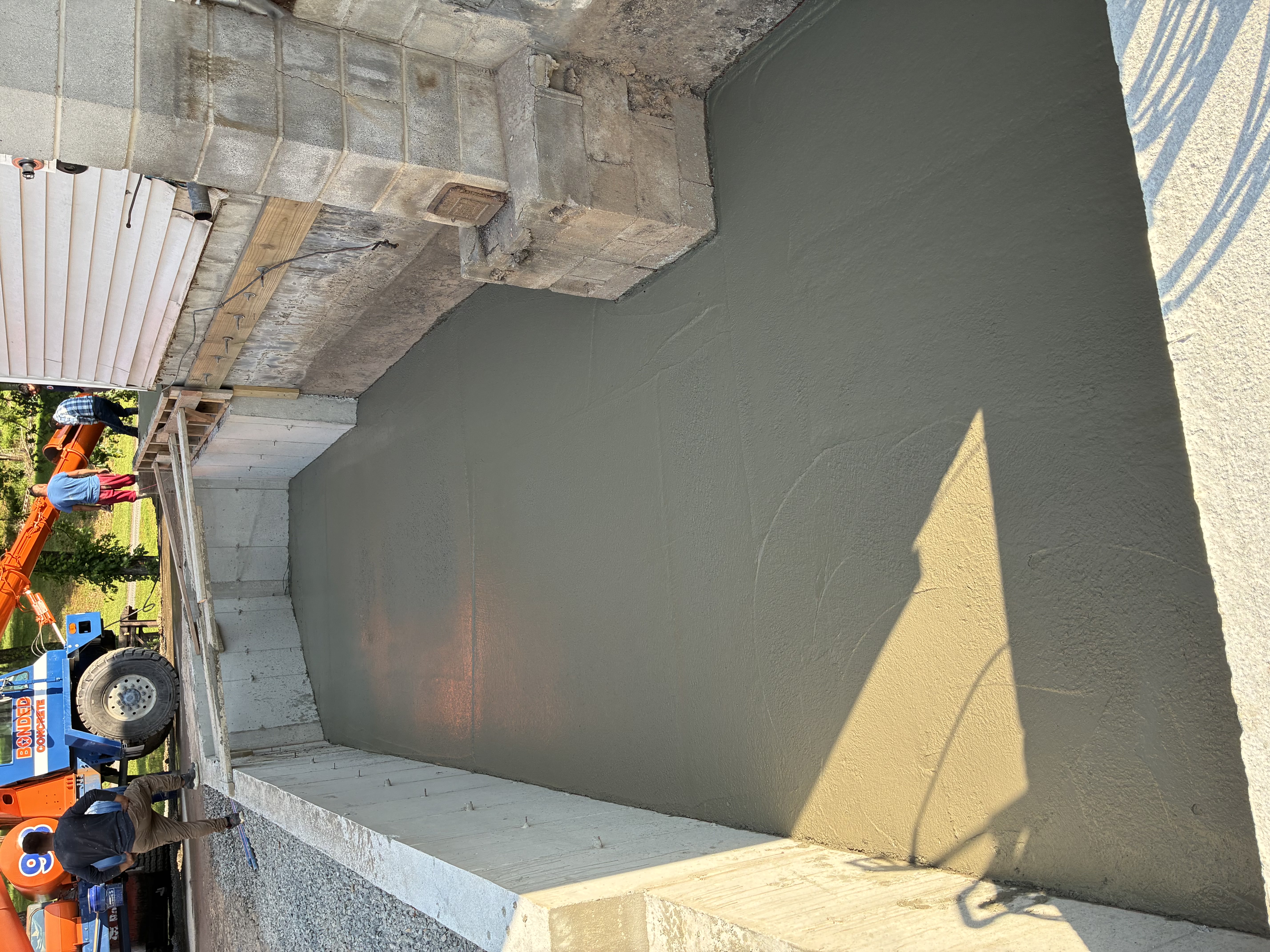 Fresh basement floor pour with smooth finish