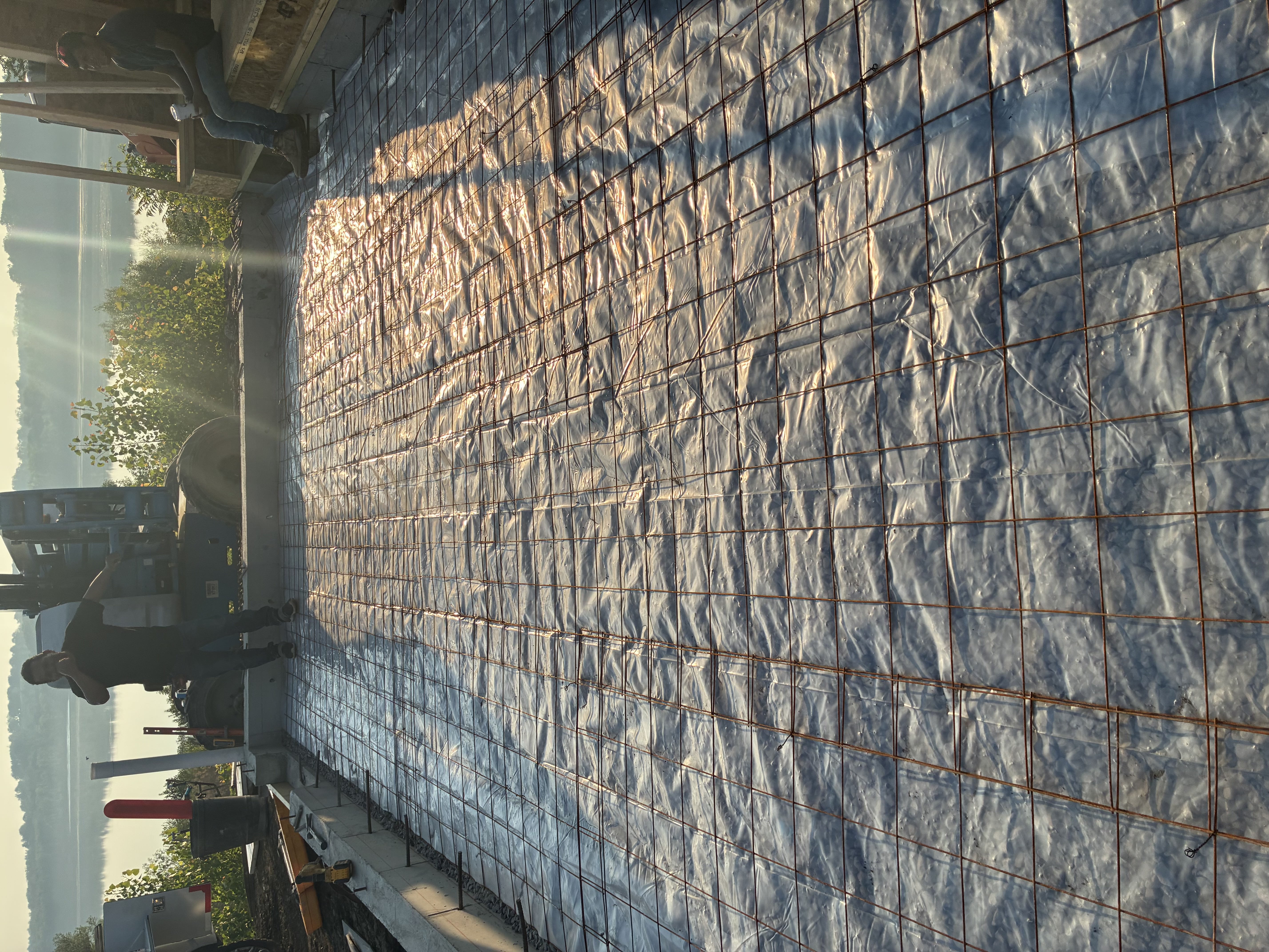 Slab prep with rebar at golden hour lakeside