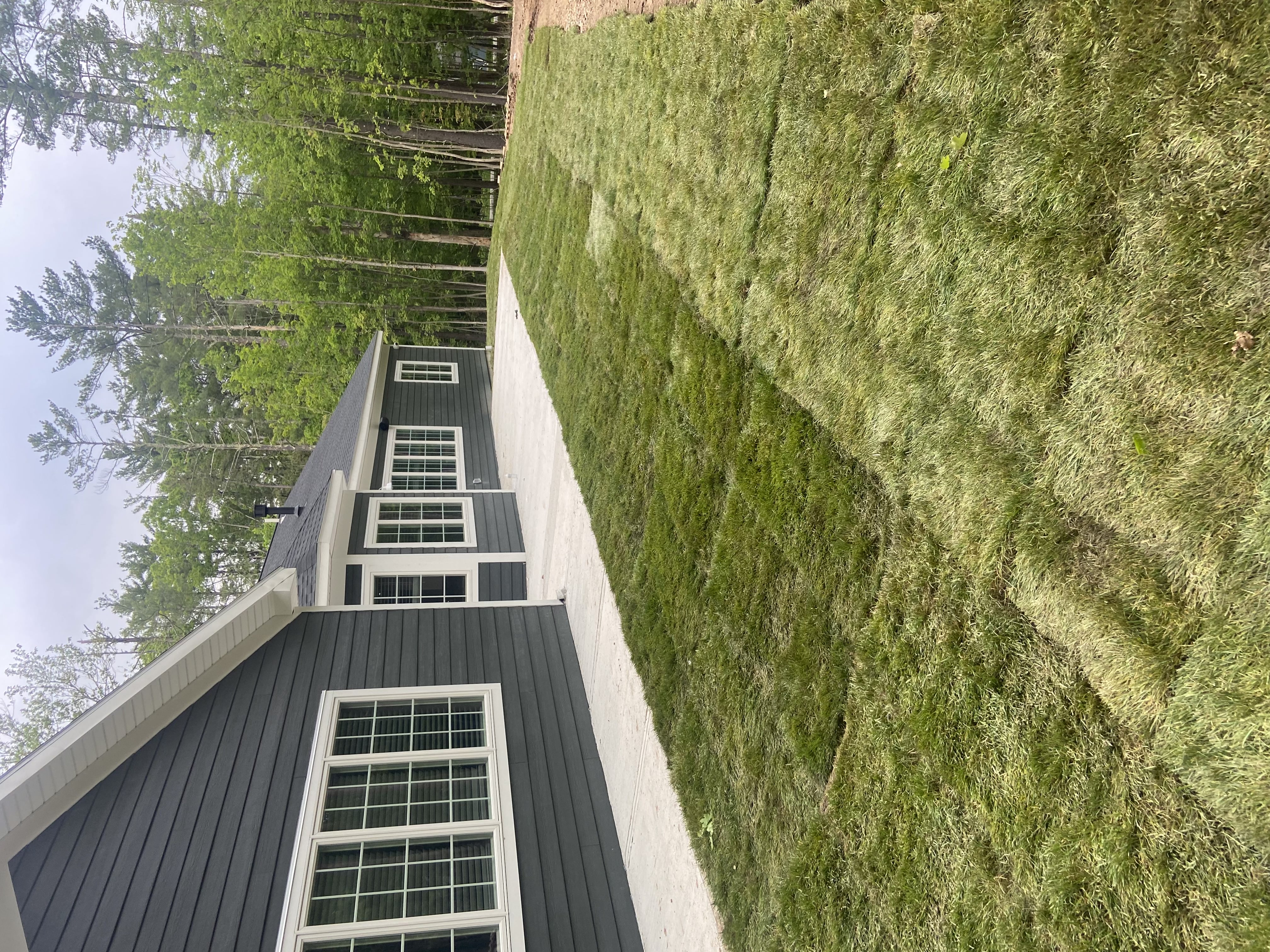 Finished concrete patio and walkway on modern home