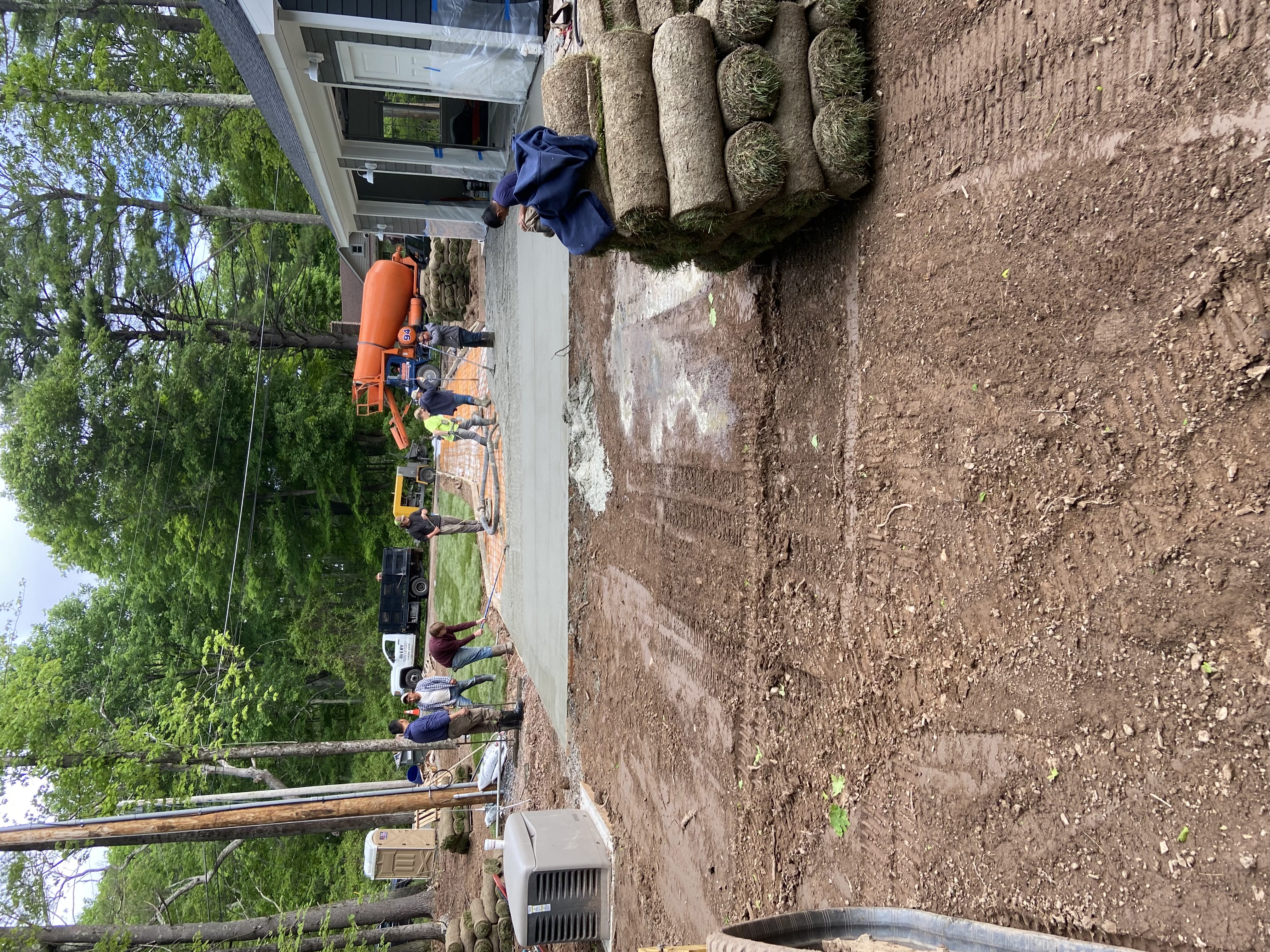 Driveway pour with large crew and mixer truck