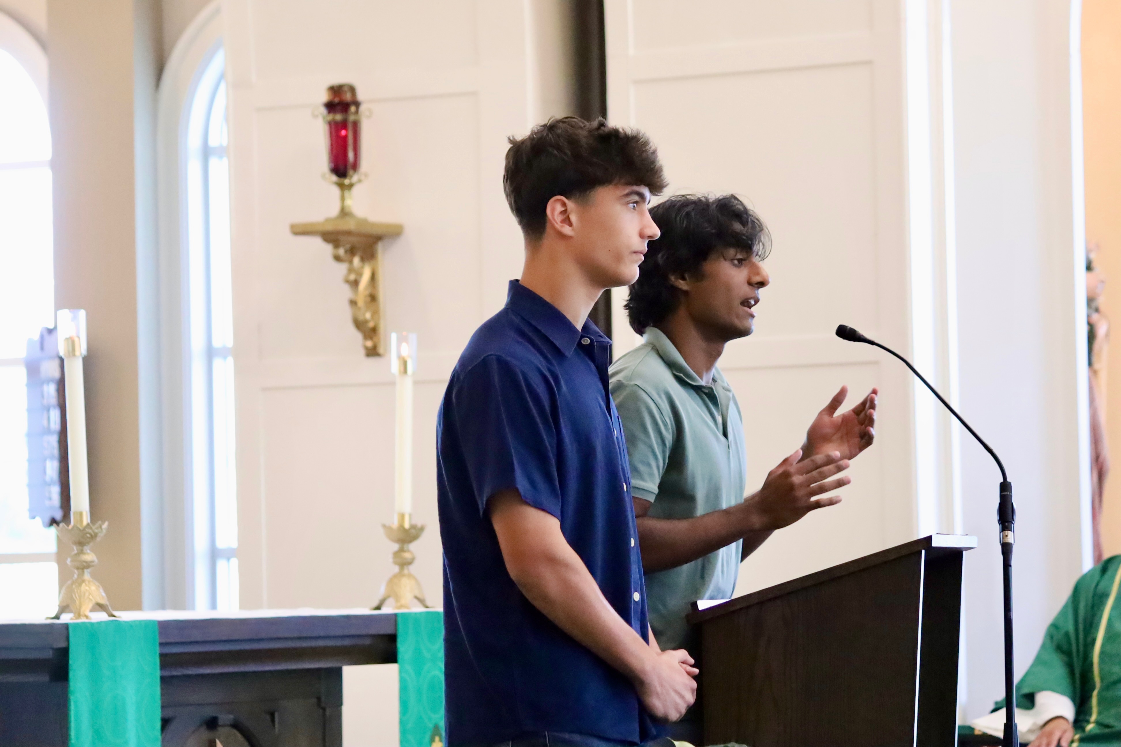 The founders addressing a congregation from the ambo during Mass