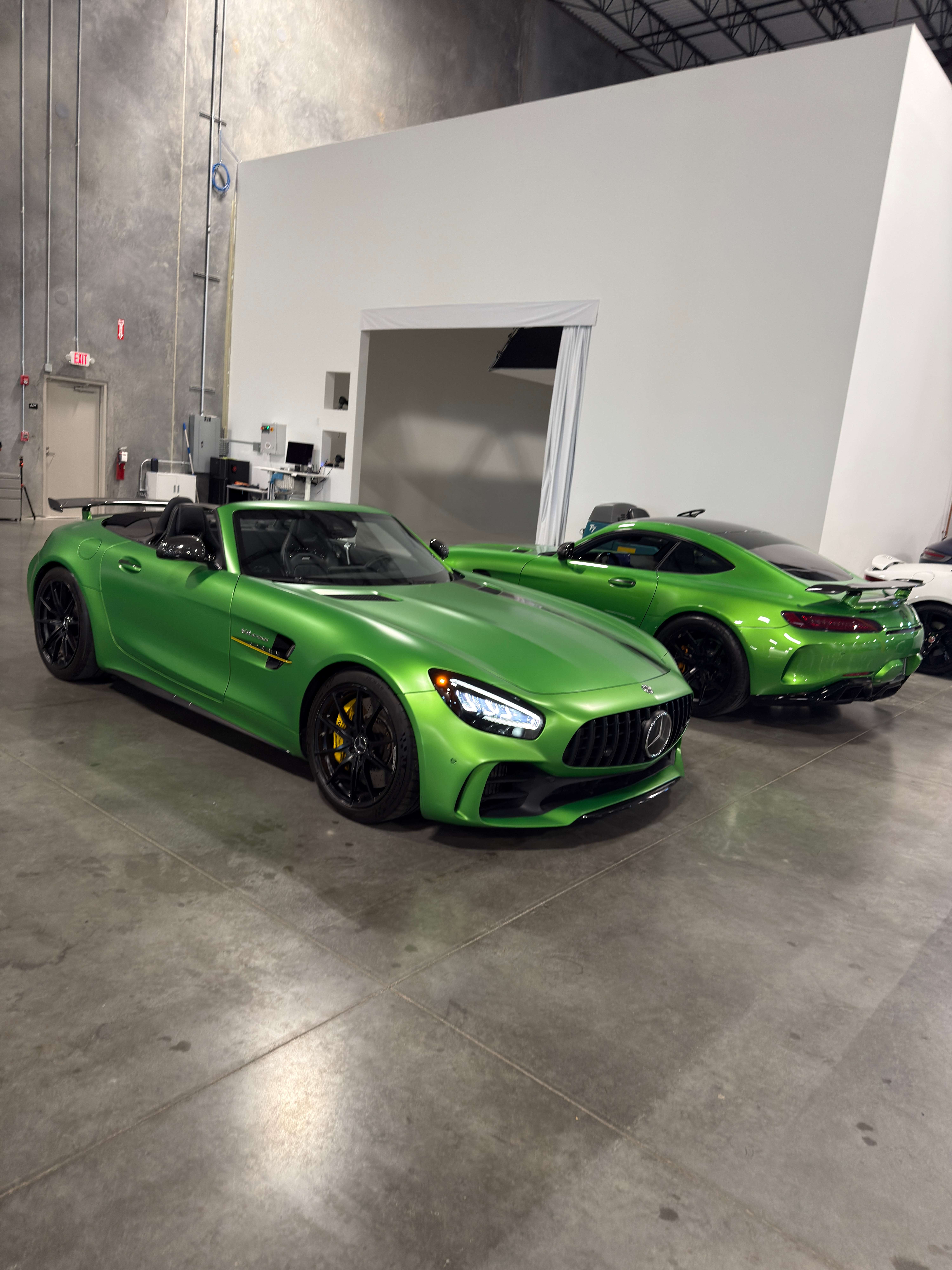 Two Mercedes AMG GT R Roadsters in AMG Green Hell Magno side by side