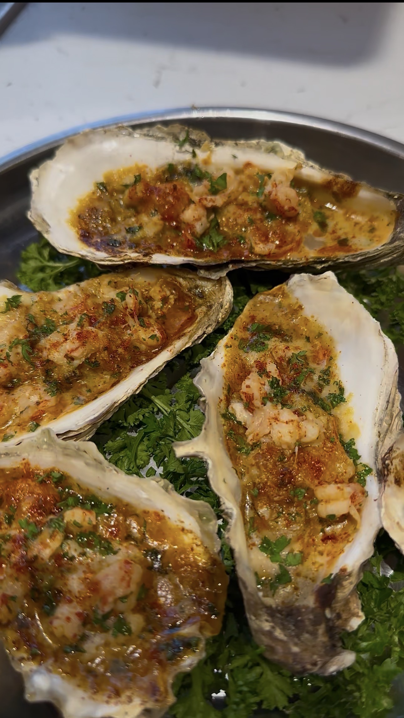 Baked oysters with garlic butter and fresh herbs