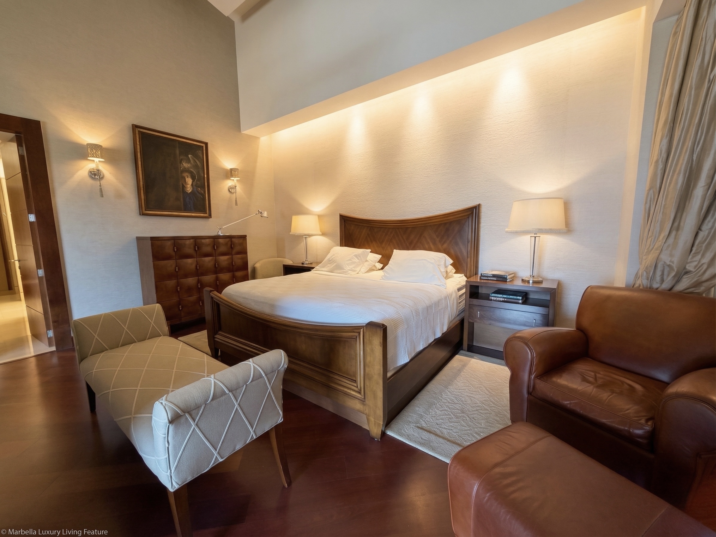 Master bedroom suite with cathedral ceiling, walnut furniture, ambient lighting and leather seating, private estate La Trinidad Caracas