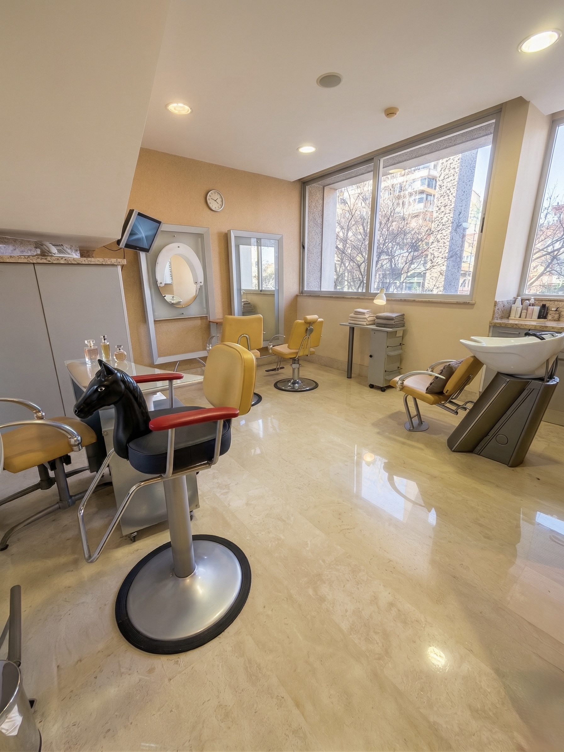 Private beauty salon with professional stations and marble floors