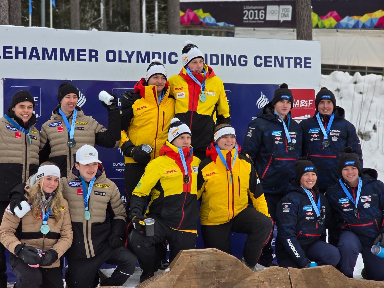Medal podium at international competition with teams from multiple countries