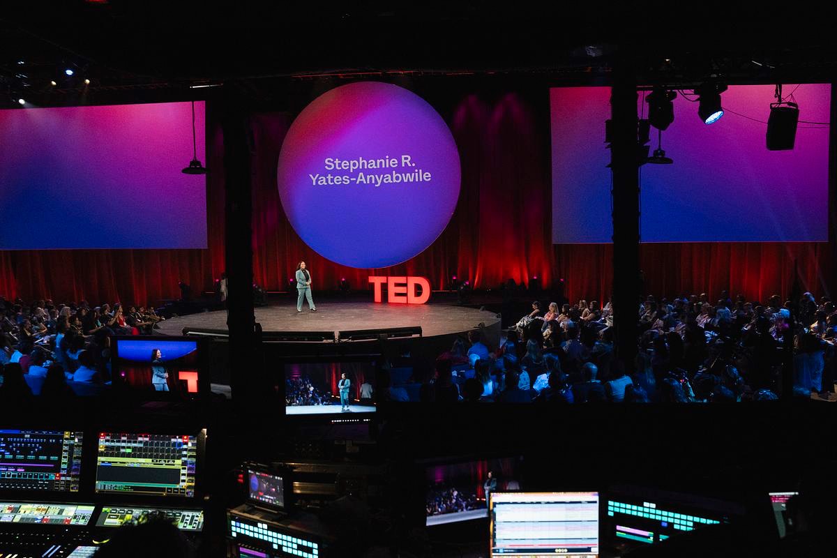 Full TED venue with Stephanie R. Yates-Anyabwile on the main screen