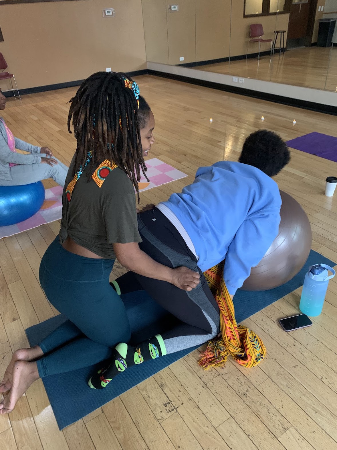 Mel providing doula support during birth preparation
