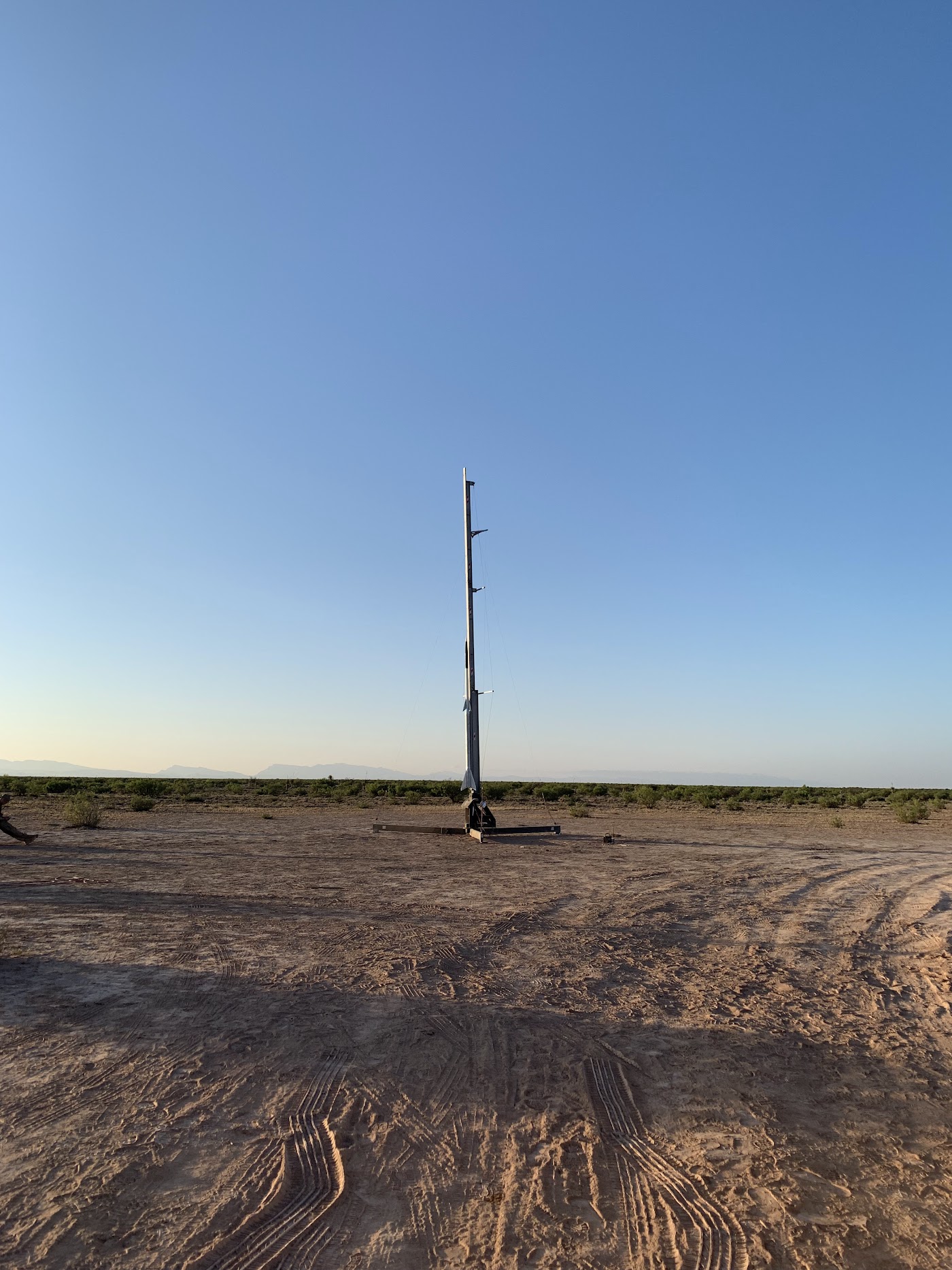 Missile launch rail in desert landscape