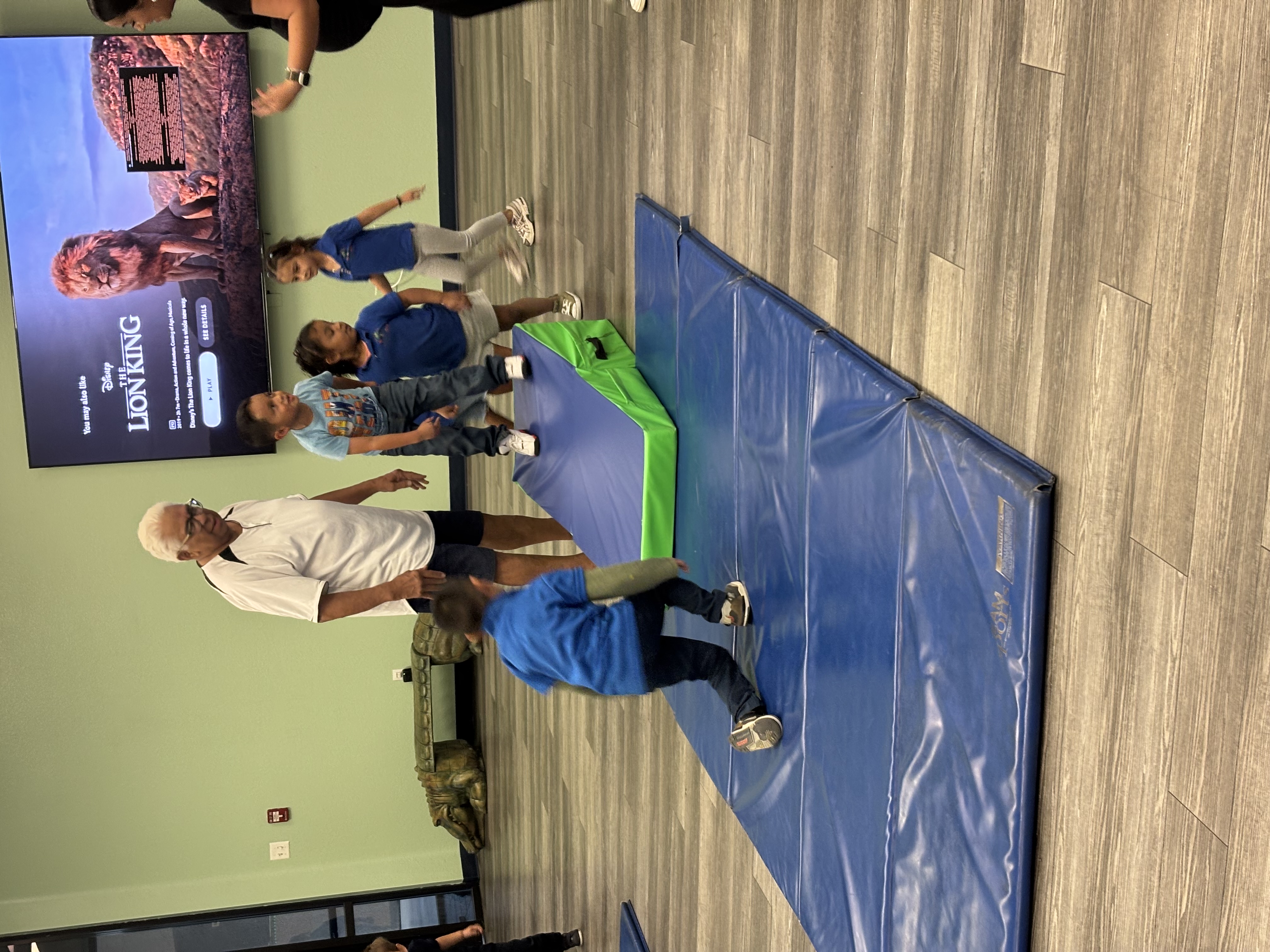 Sunny Day Foundation youth active gymnastics and movement session with mentors and happy kids