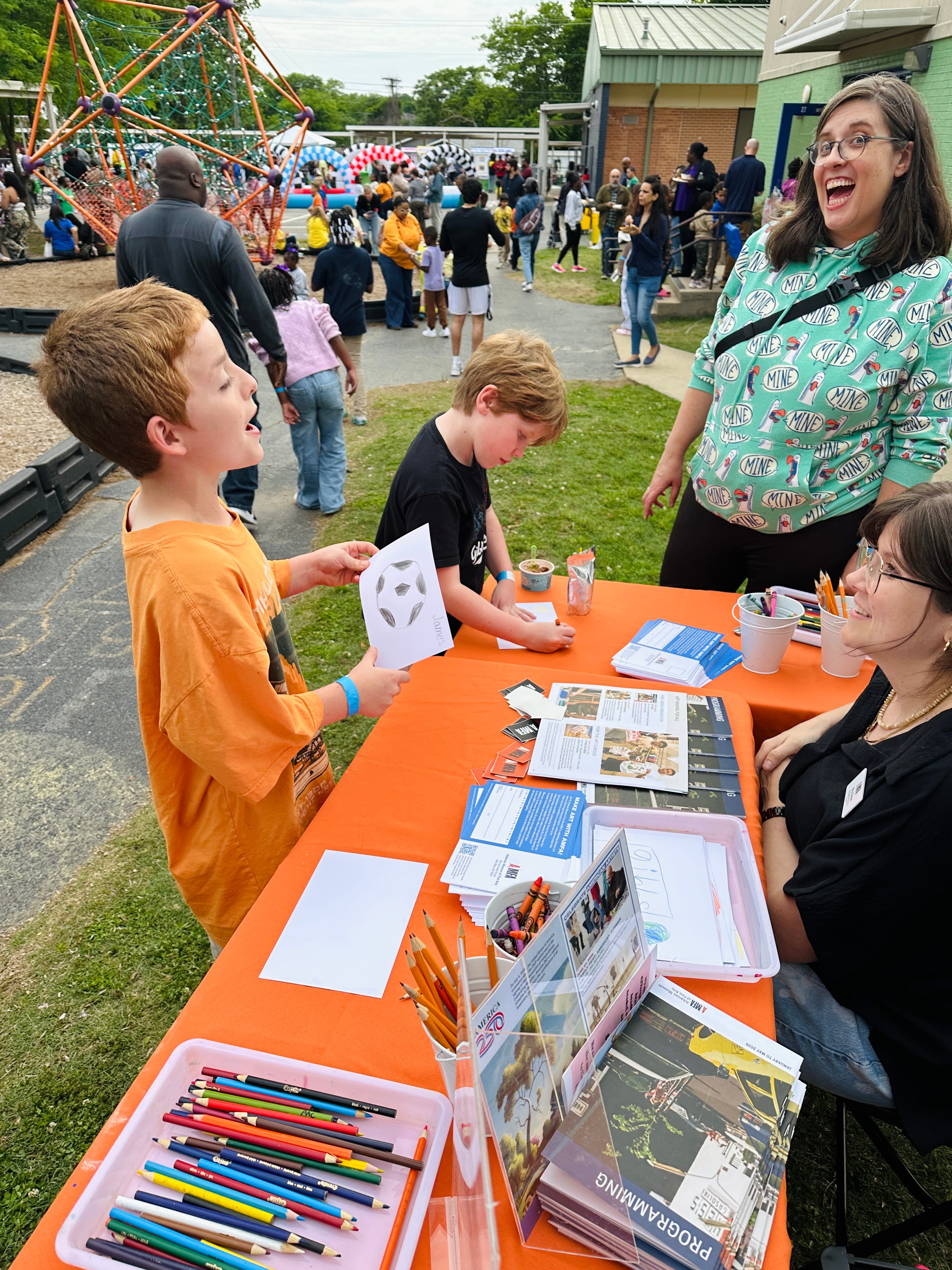 Kids doing crafts at activity table