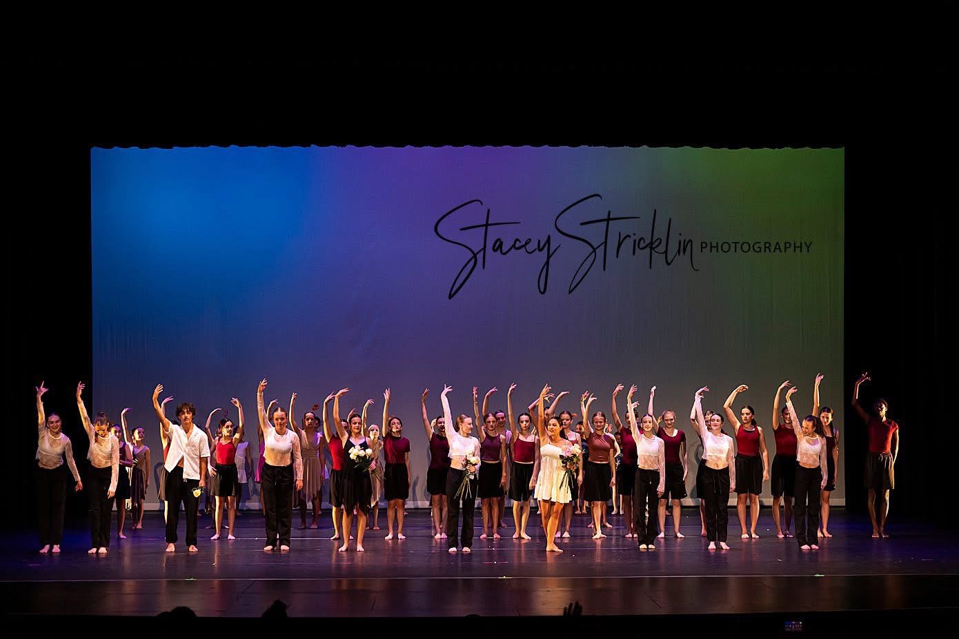 A full cast taking their final bow on stage