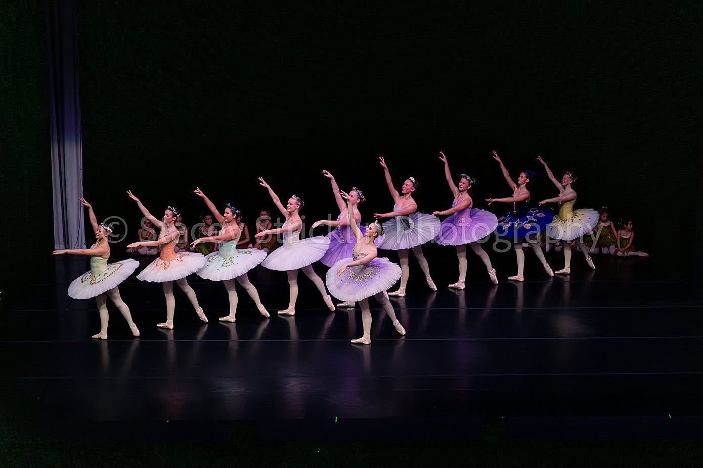 Dancers performing a colorful holiday production