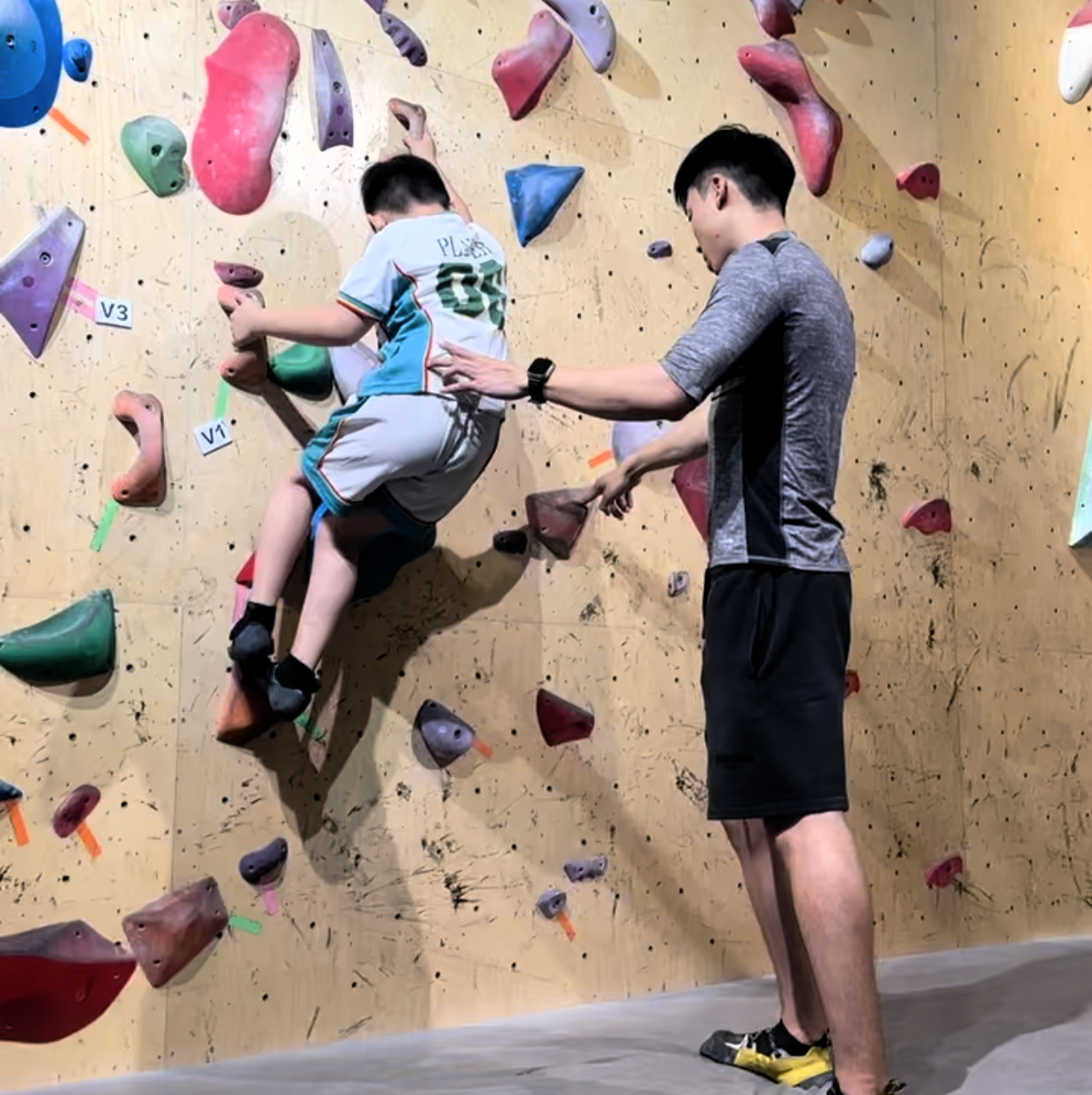 Charlie Wu teaching climbing