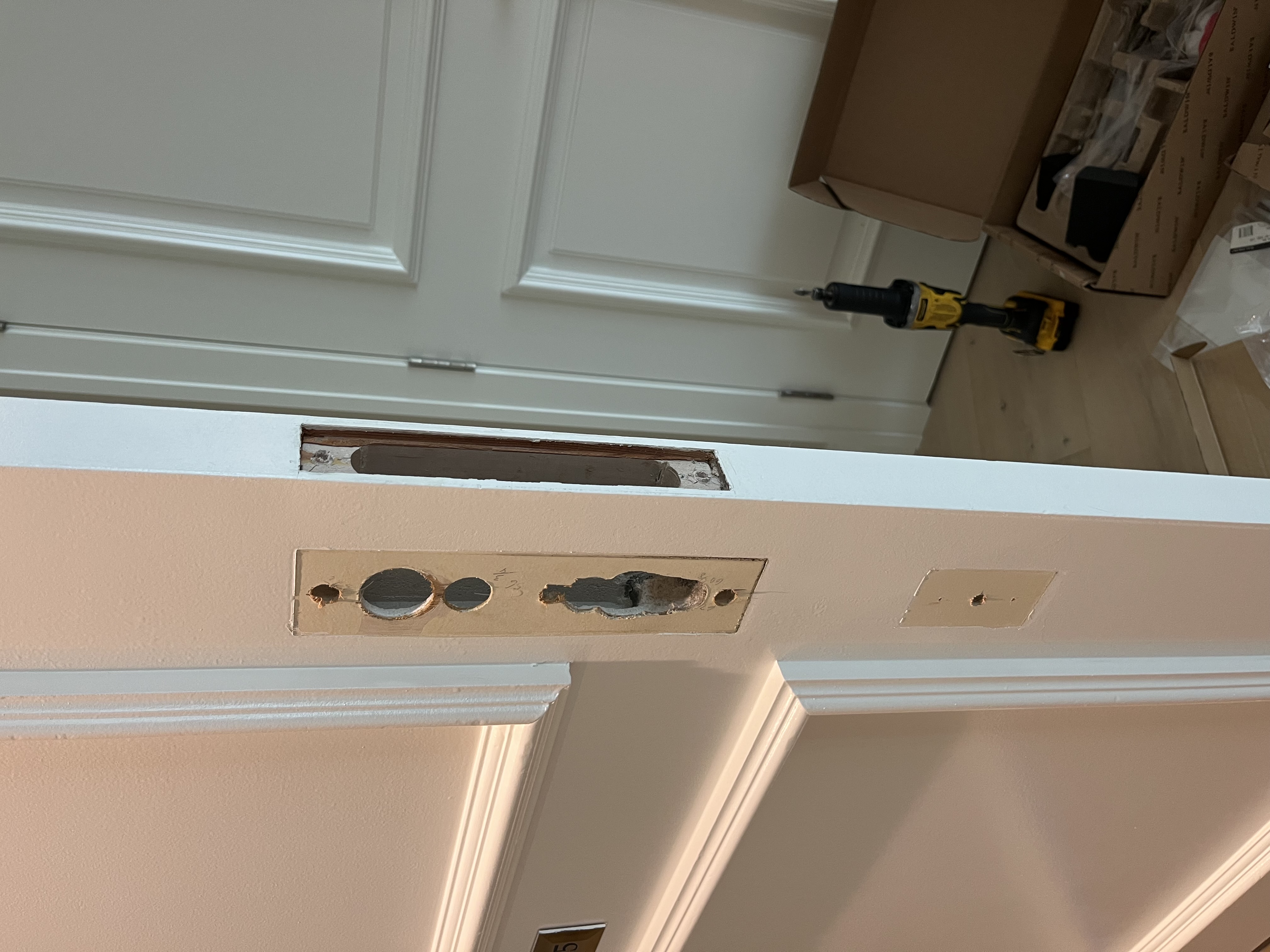 During: old mortise lock removed, showing the empty mortise pocket in the door edge
