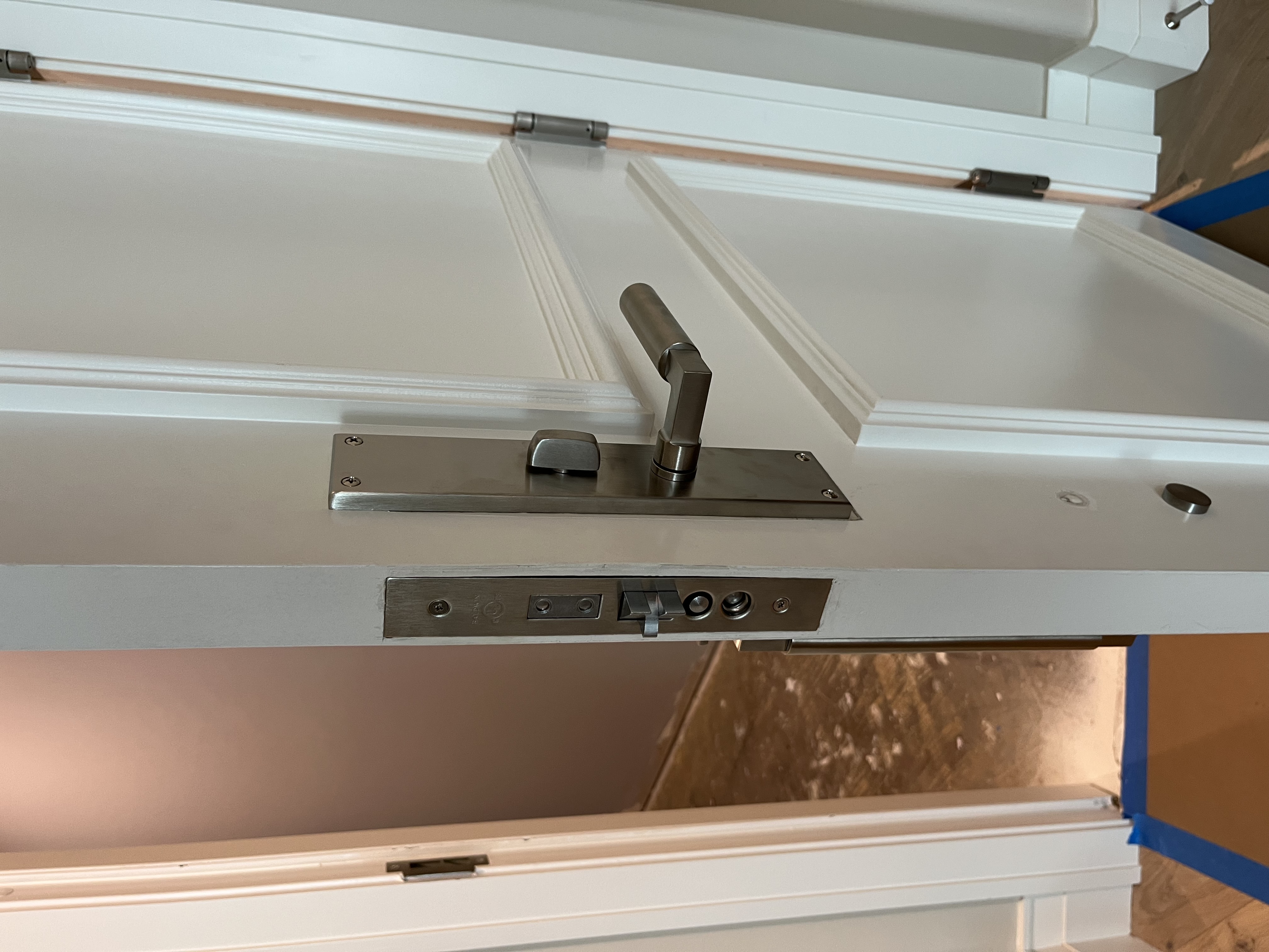 During: new Baldwin mortise body being fitted with lever hardware in place