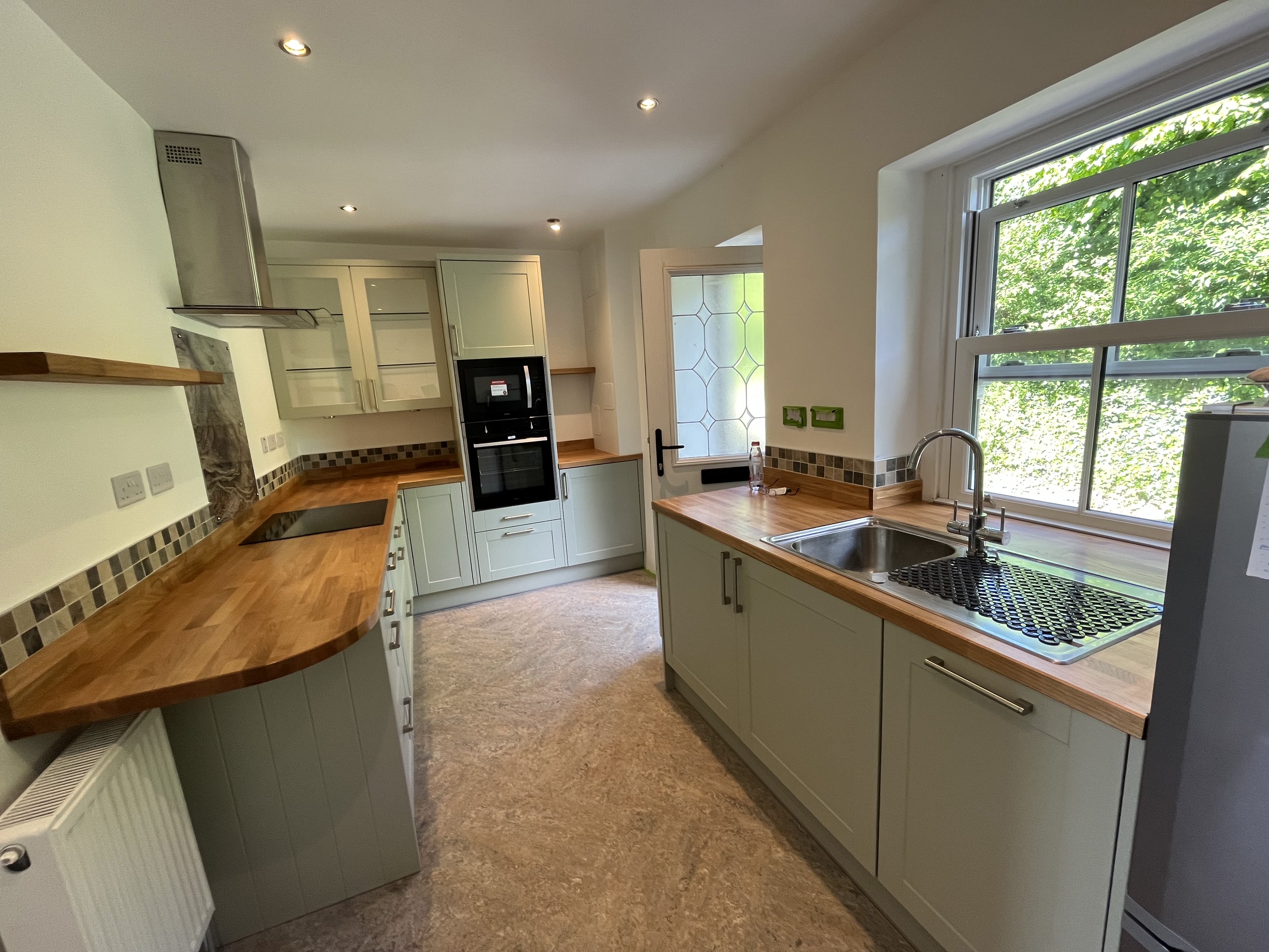 Kitchen with large window and garden view