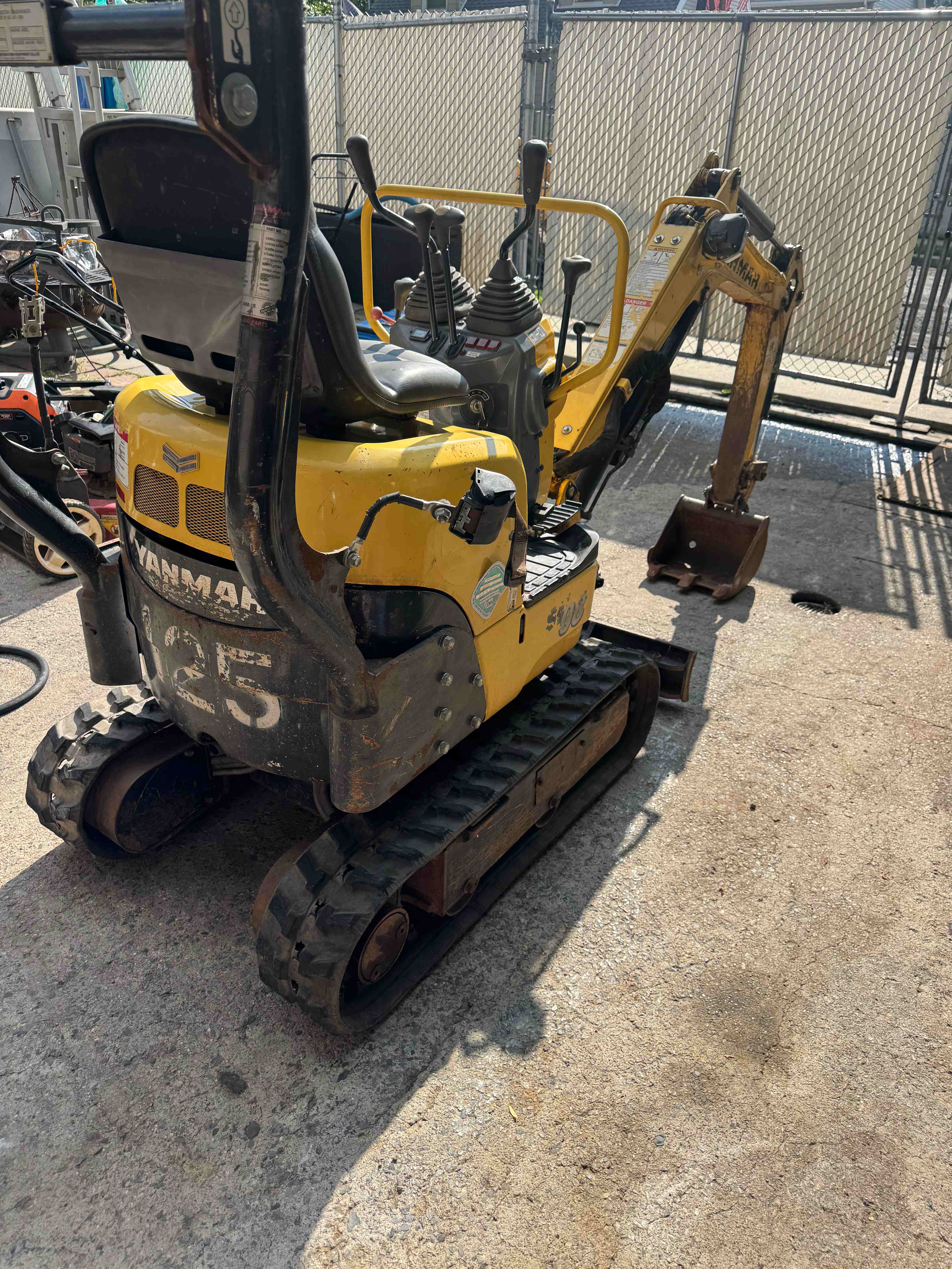 Yanmar SV08 mini excavator rear view showing the SV08 badge and rubber tracks