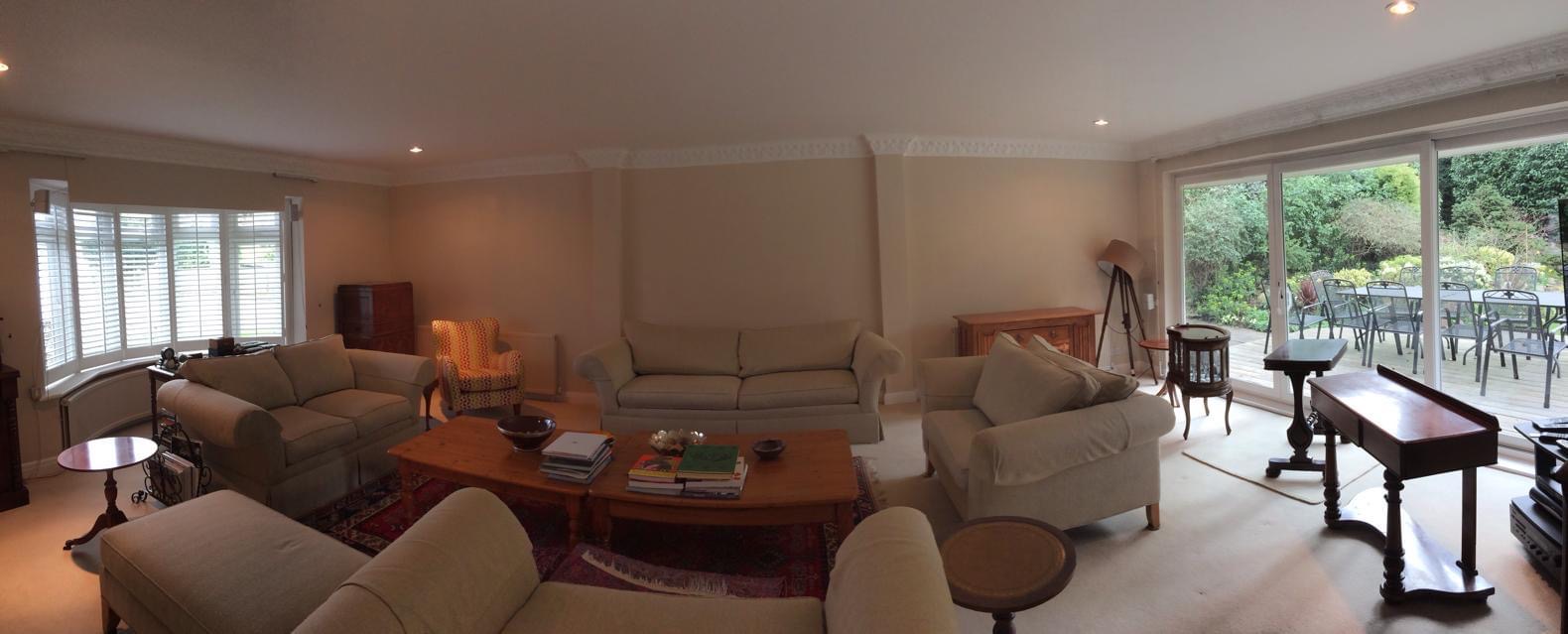 Spacious living room with garden views