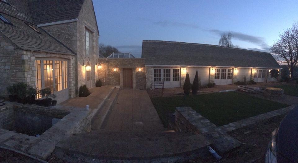 Cotswolds stone property exterior at twilight