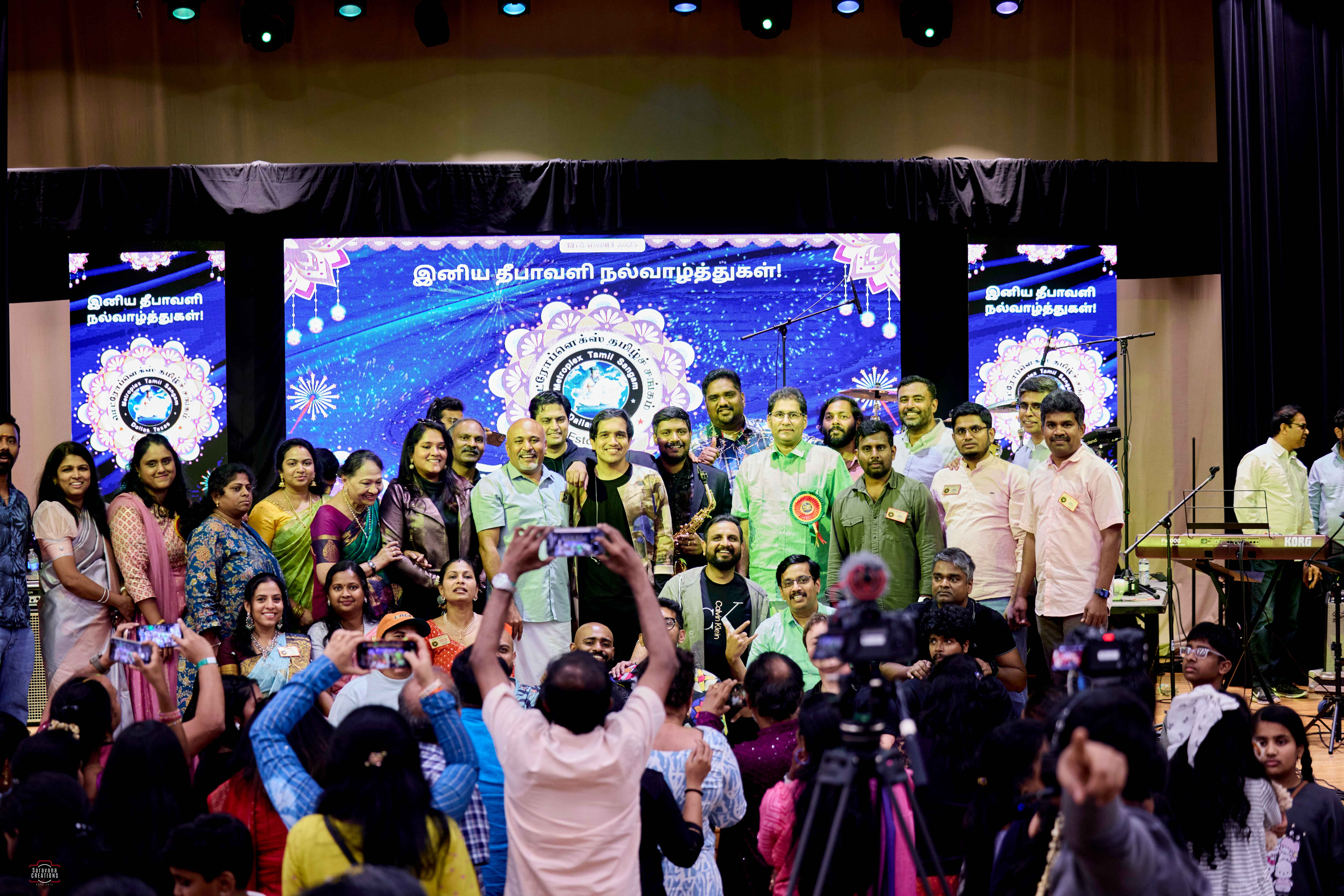 Band and audience group photo on stage