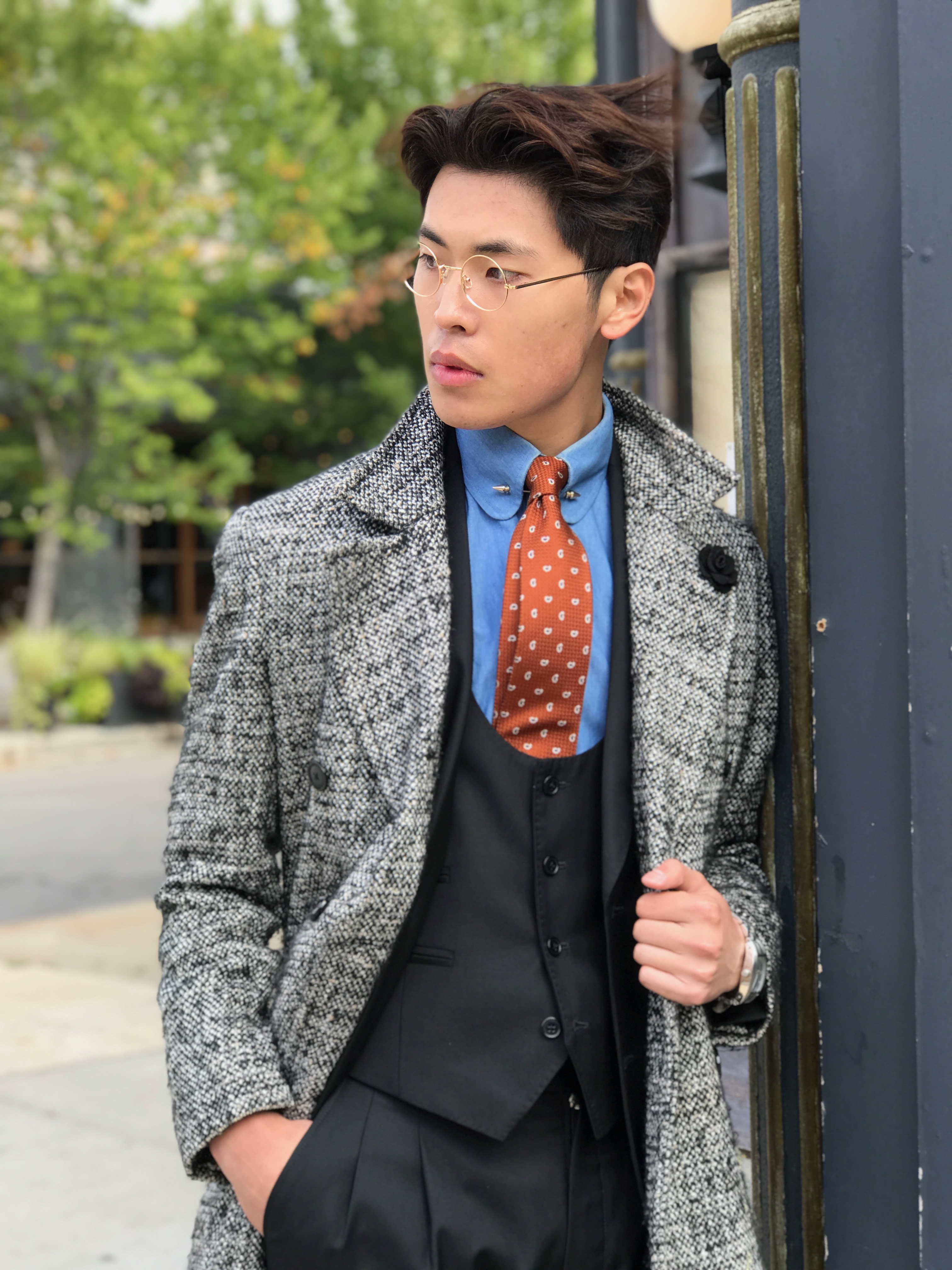 Man wearing a custom tailored suit with tweed overcoat