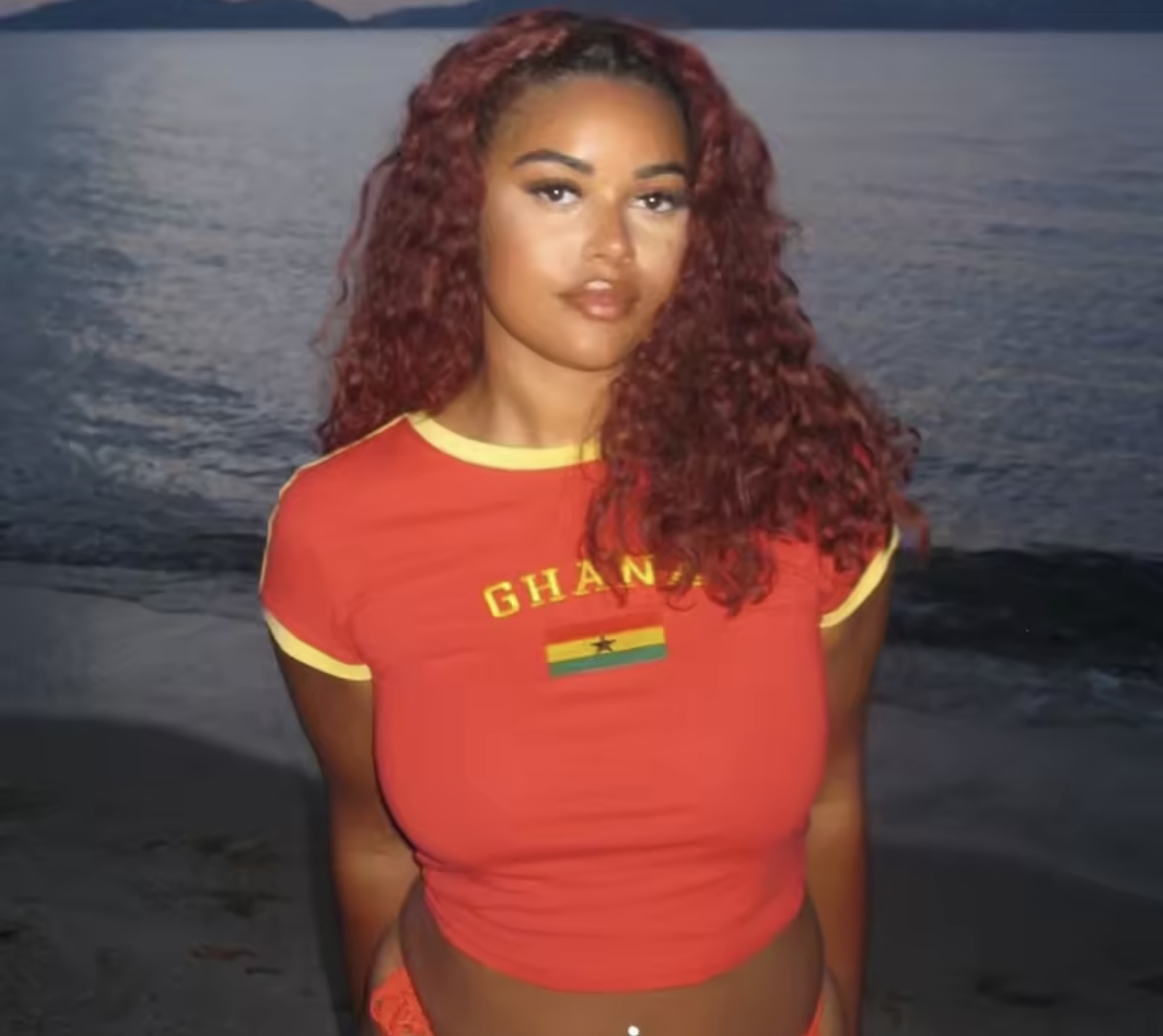 Model wearing Ghana Gold crop top