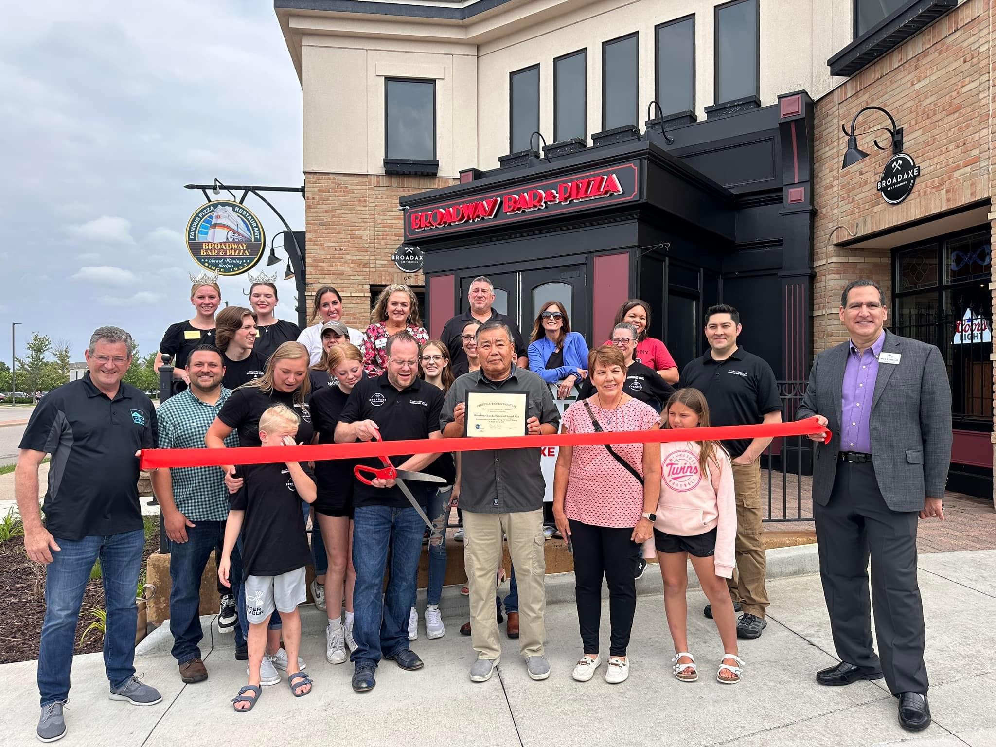 Broadway Bad's Pizza grand opening with community members