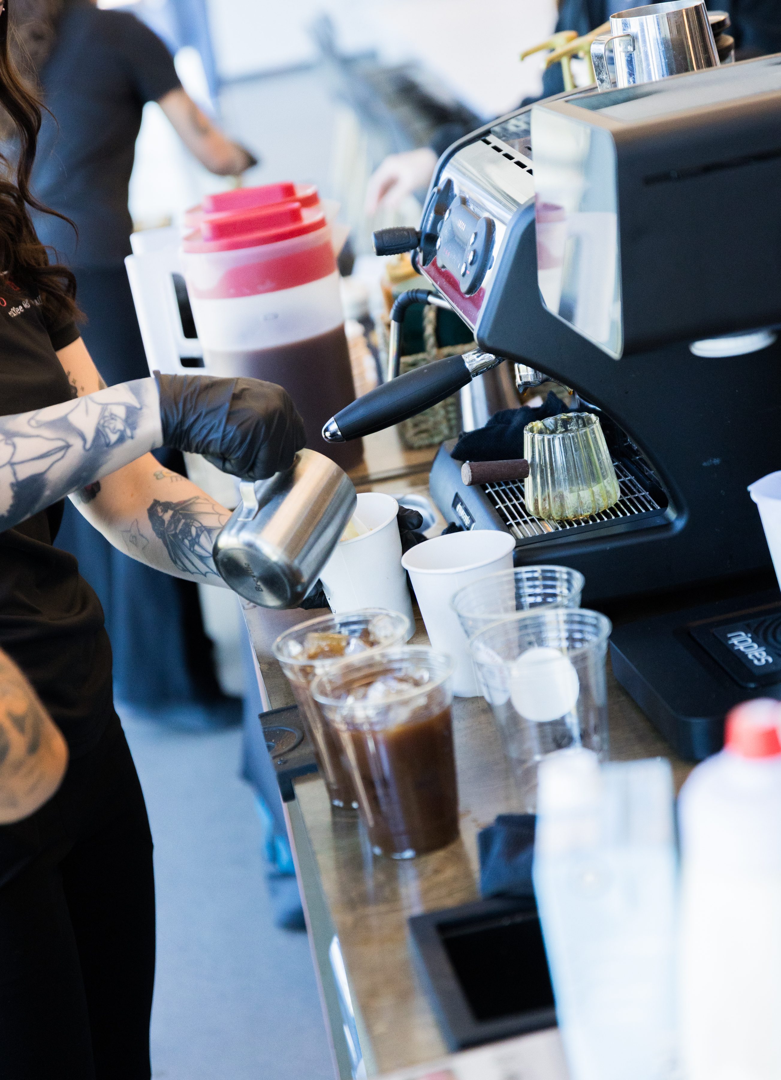 Professional barista preparing espresso drinks Phoenix coffee catering